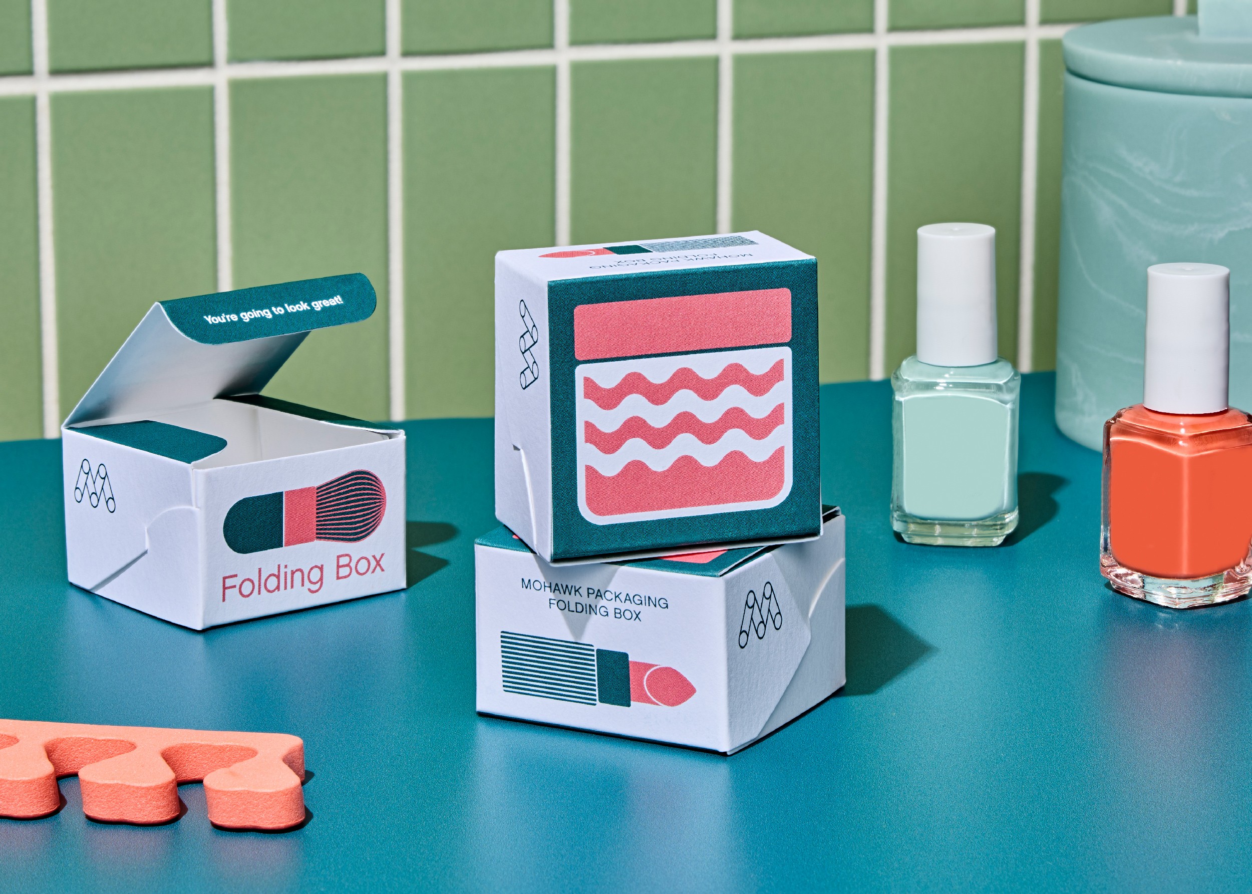 Streetside billboard with flyposters of the Batch.Works brand and illustrations