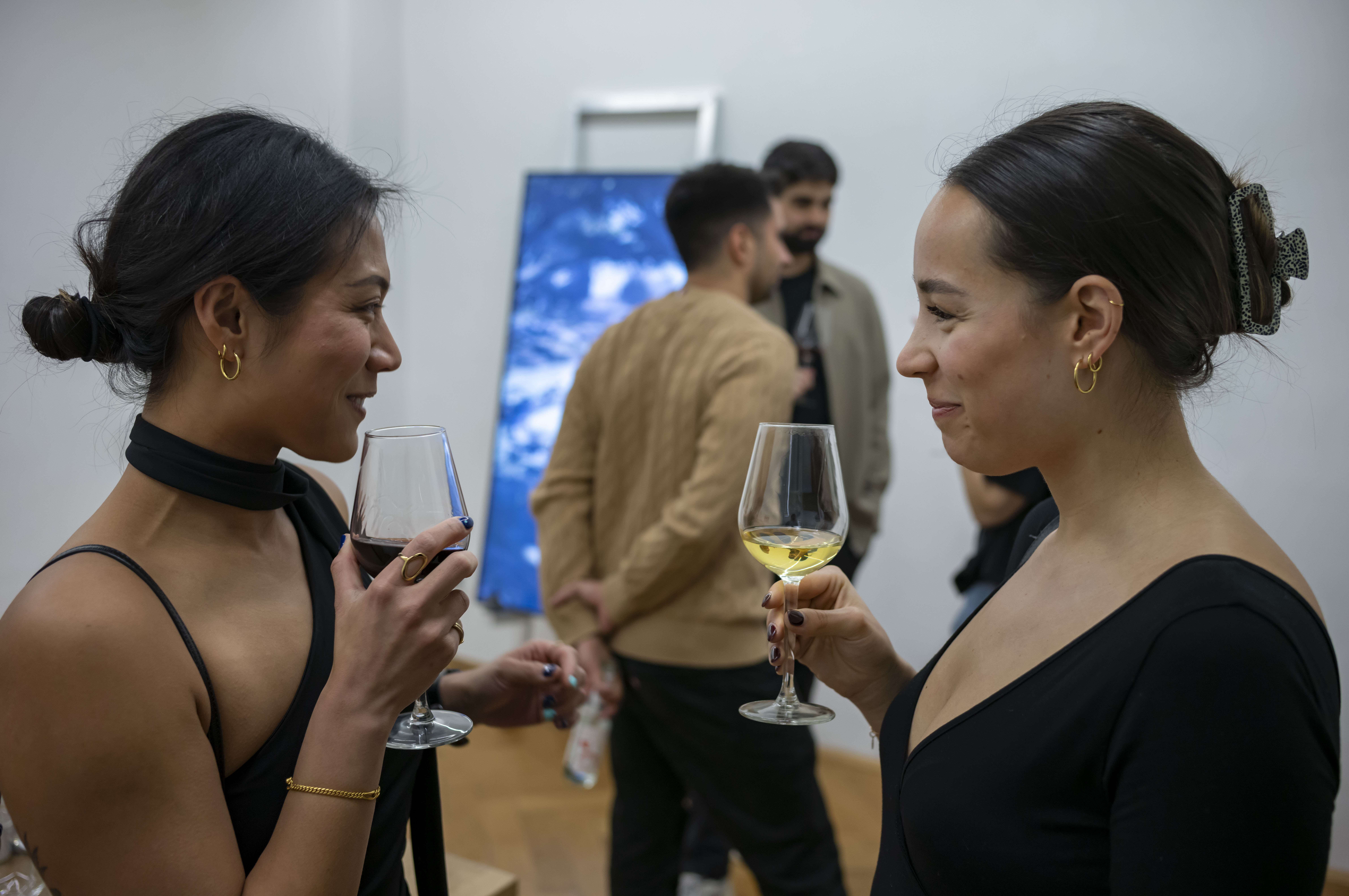 Entrepreneurs engaging in a lively discussion during a Bizz Buzz networking event.