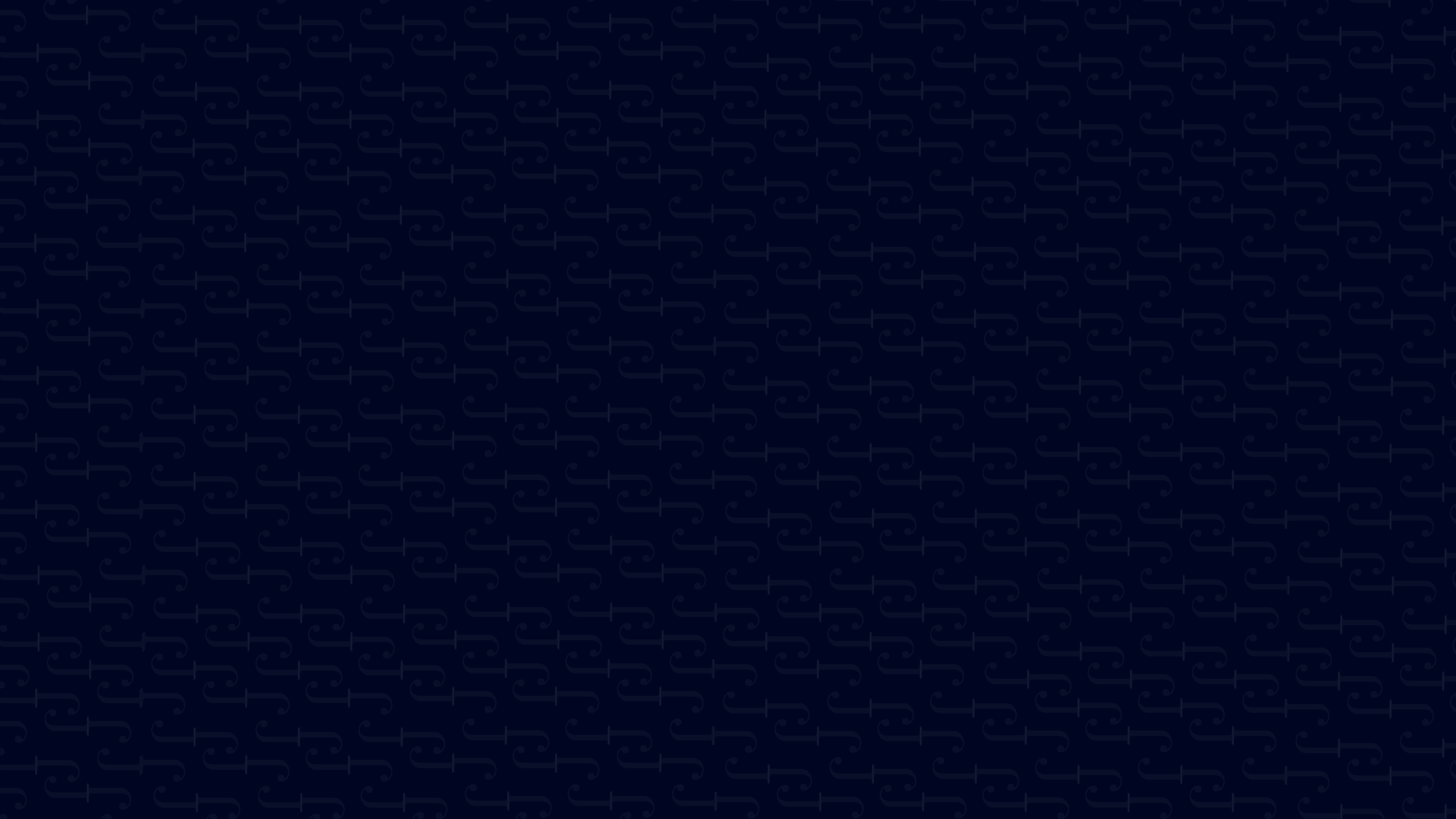 woman in blue tank top standing beside white wall