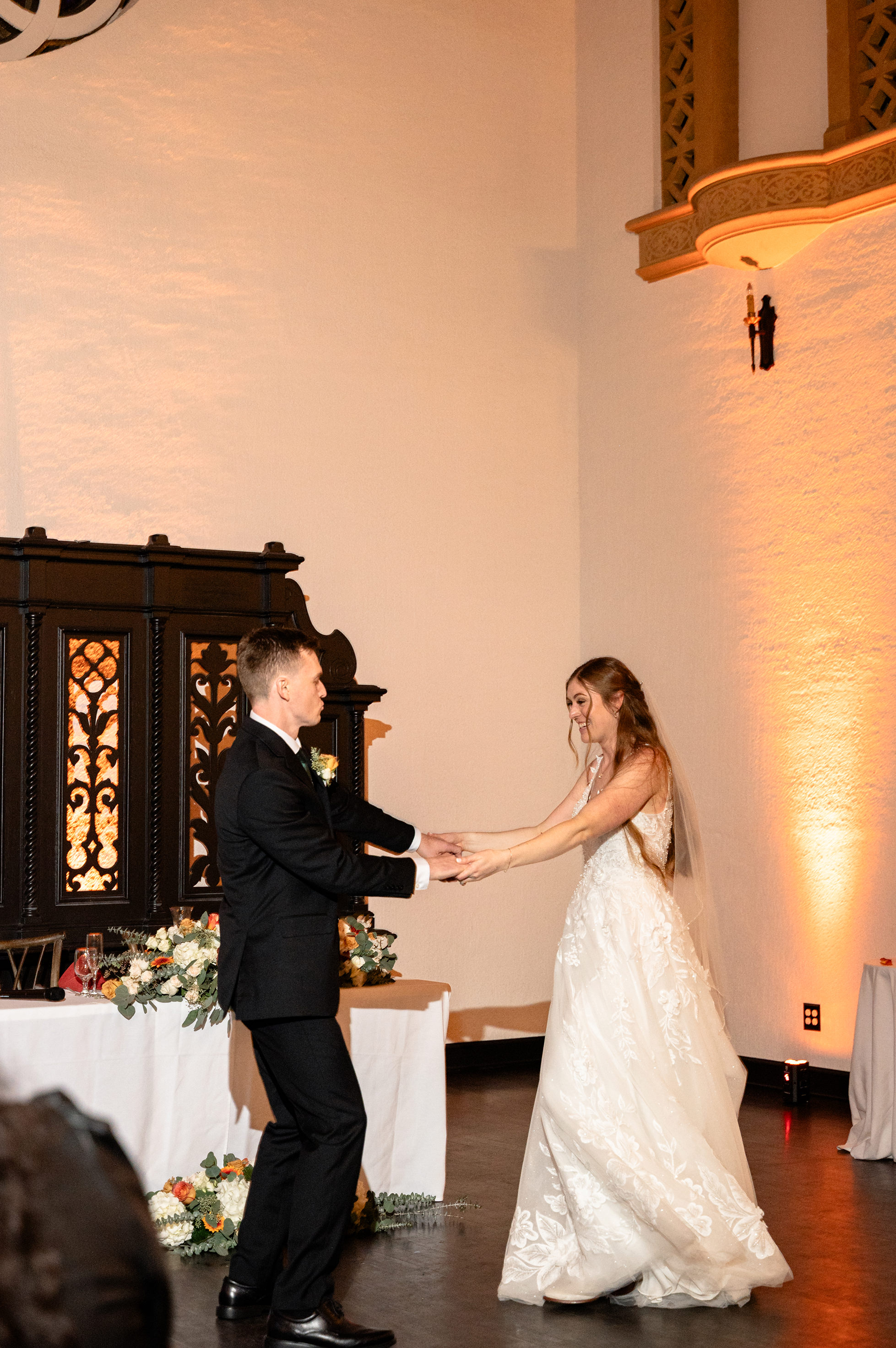 Flat lay wedding details with bouquet, rings, and sparkling bridal heels