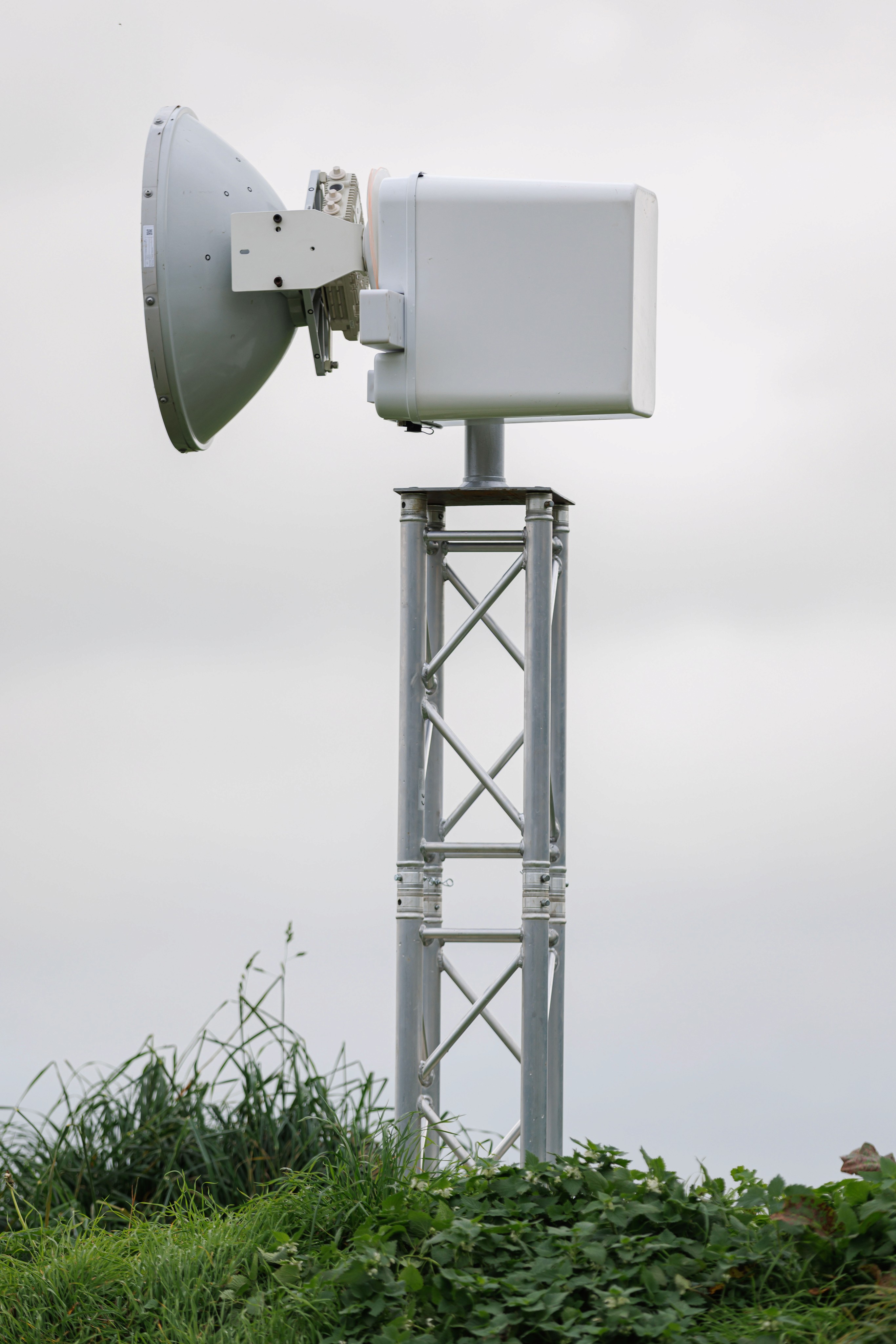 acculink microwave technology against a grey cloudy sky