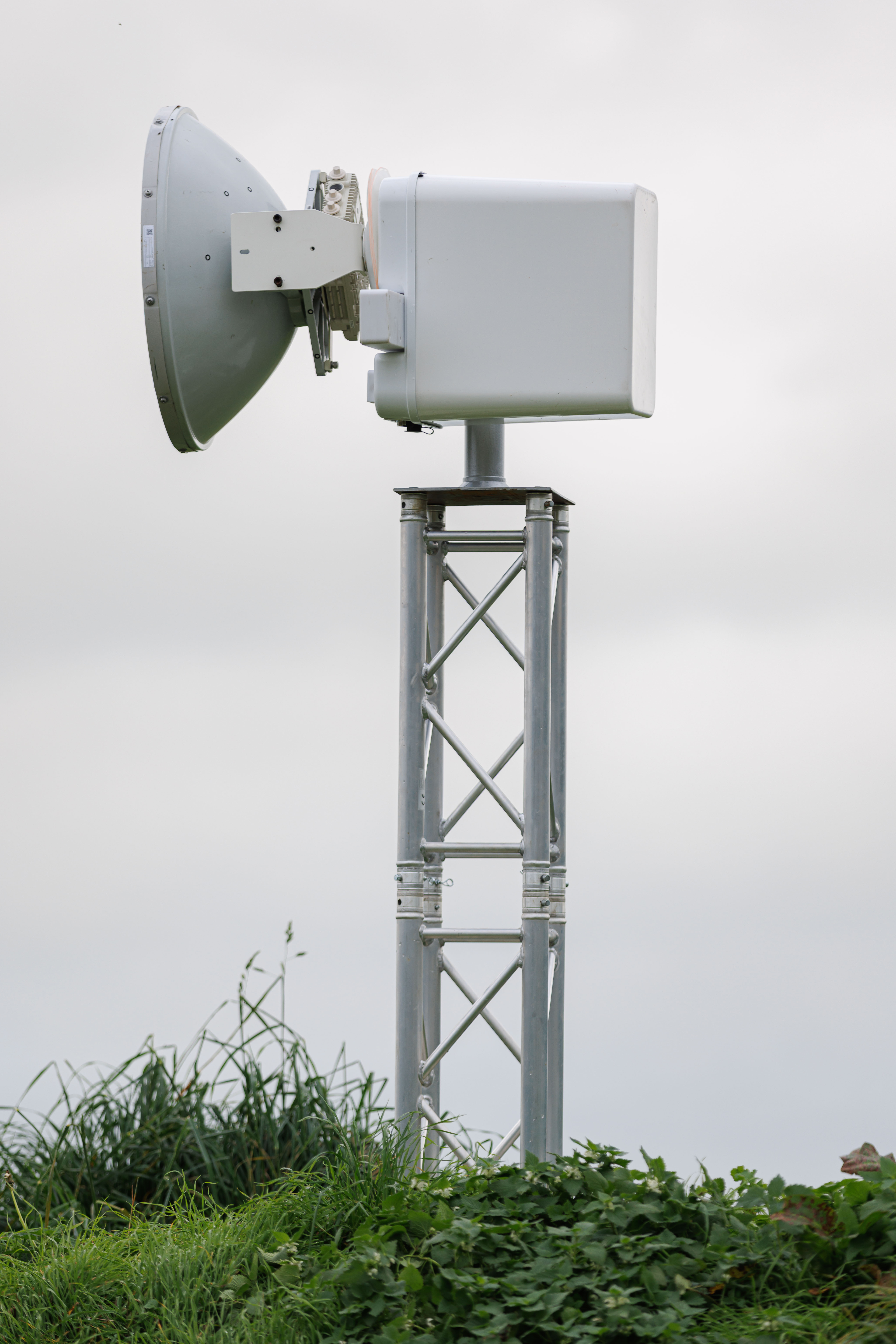 acculink microwave technology against a grey cloudy sky