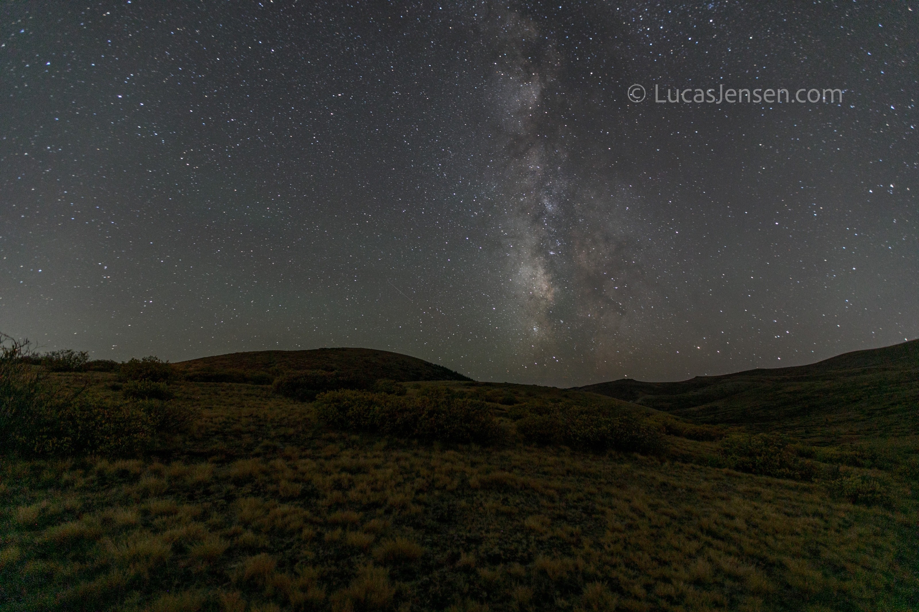 landscape photograph of mountains, water, desert, or coast by Lucas Jensen