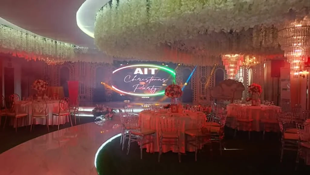 Company event stage with LED presentation screen inside Celestia Hall, Stalla Suites QC