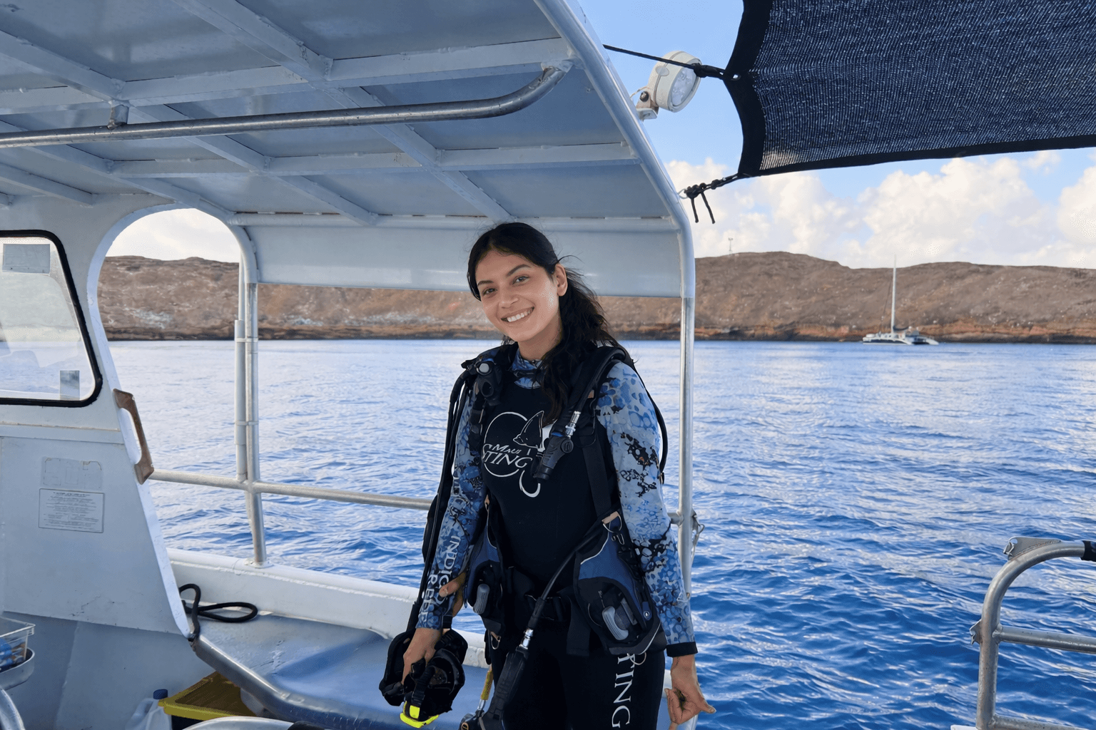 People playing soccer on a rooftop court surrounded by city buildings