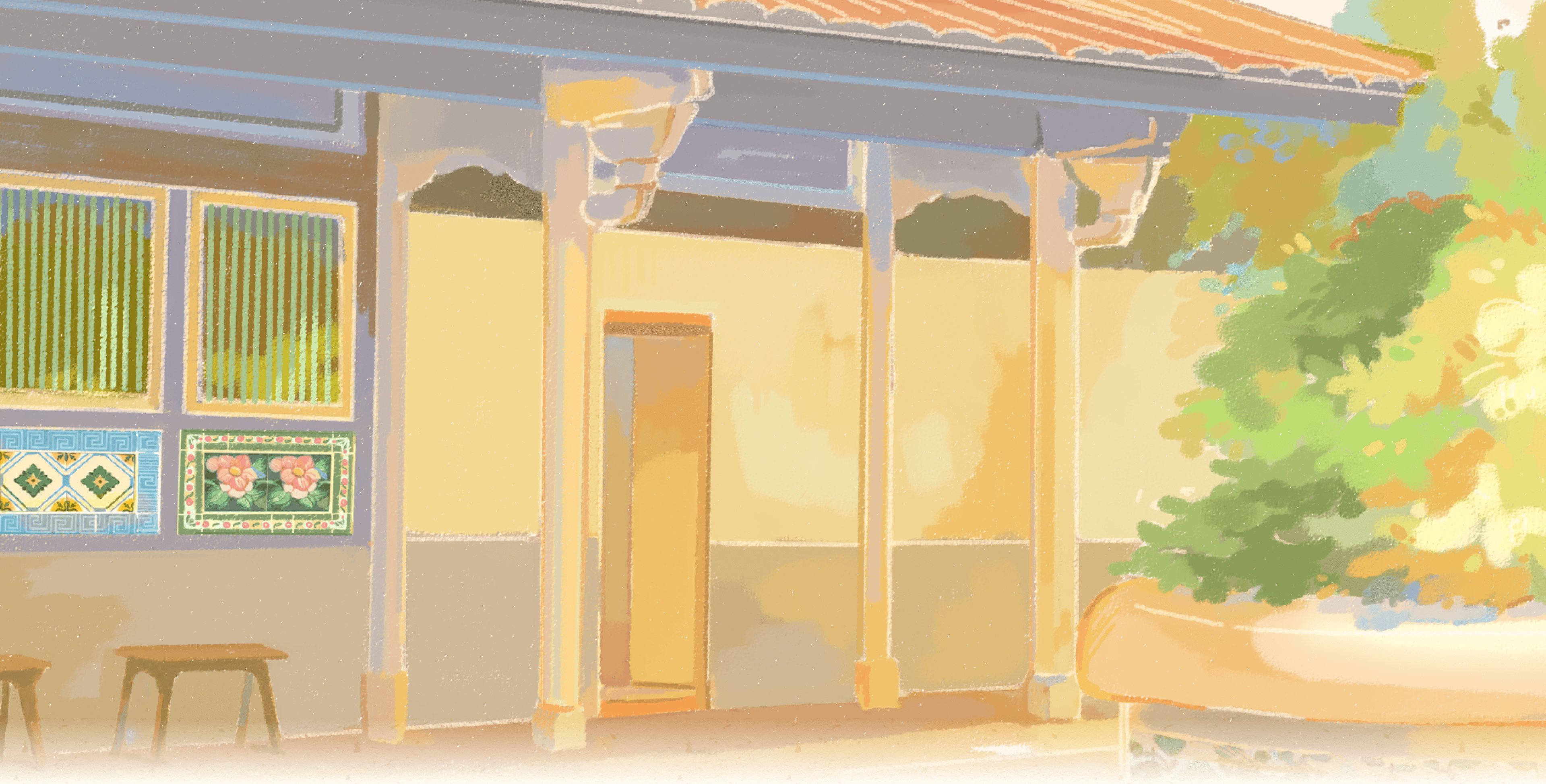 灑滿陽光的三合院，牆上與盆栽都鑲有亮麗的花磚，畫著金盞花、牡丹花...等圖樣。