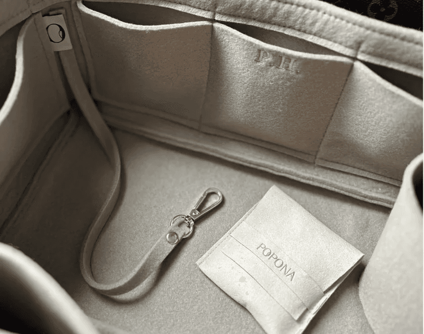 Popona handcrafted organizer fitted inside a premium handbag
