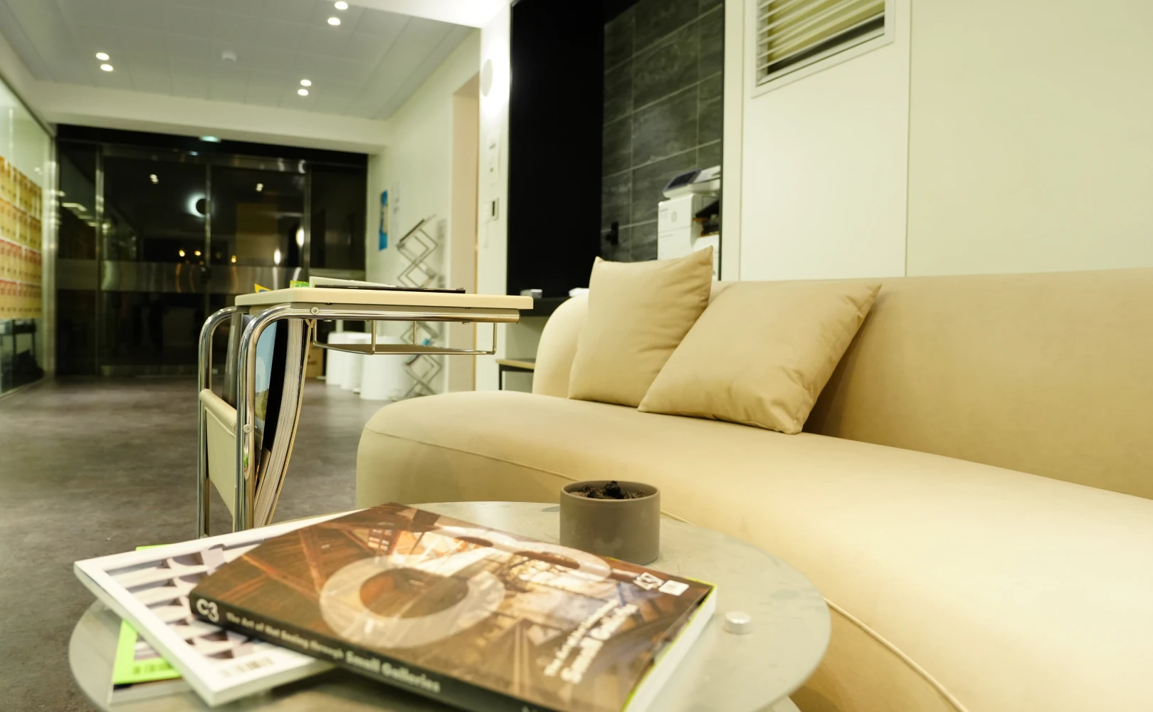 Lone pine tree on snowy hill at sunrise