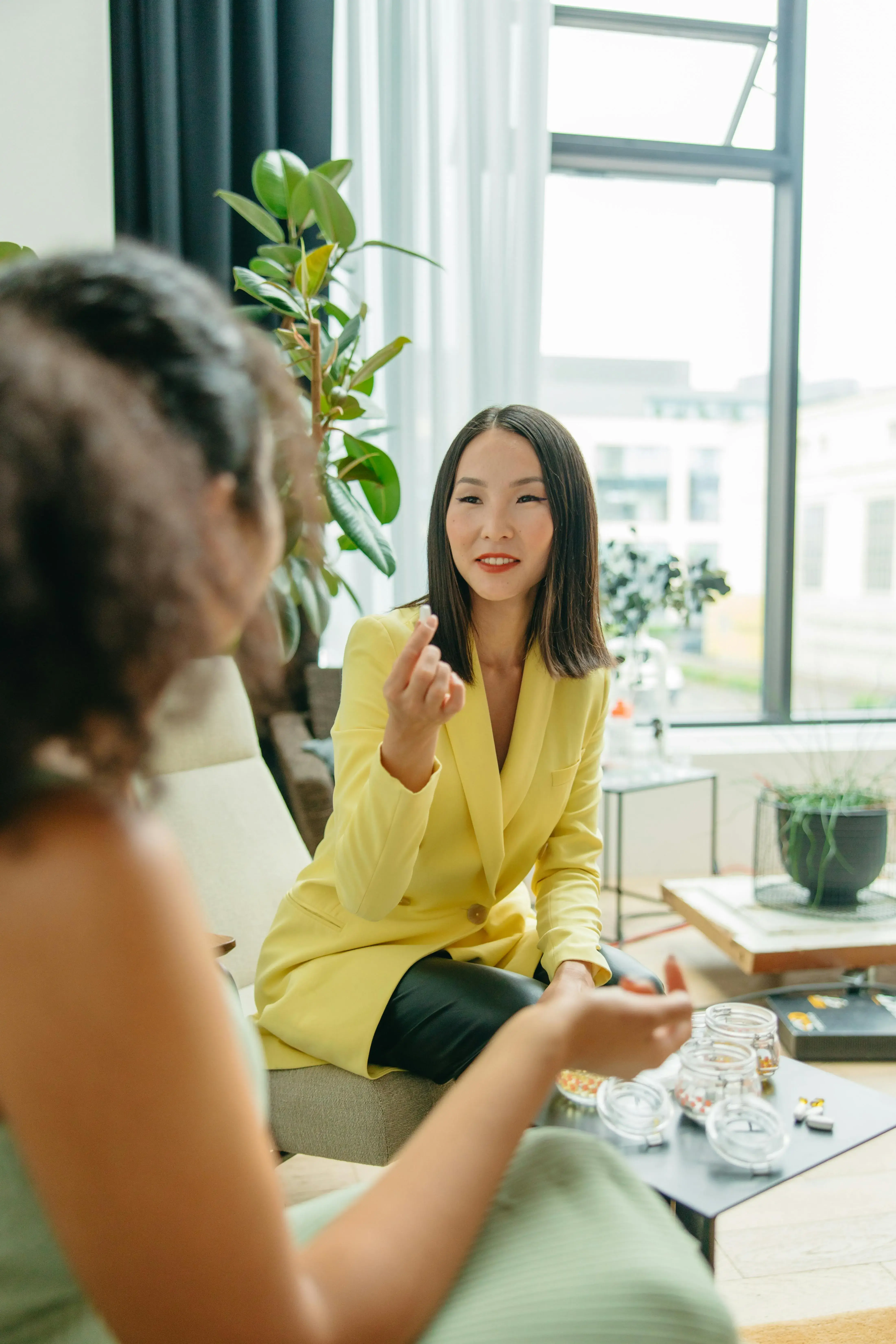 Professional consultation scene showing a wellness expert speaking with a client, representing next-generation therapy for recovery, vitality, and resilience.