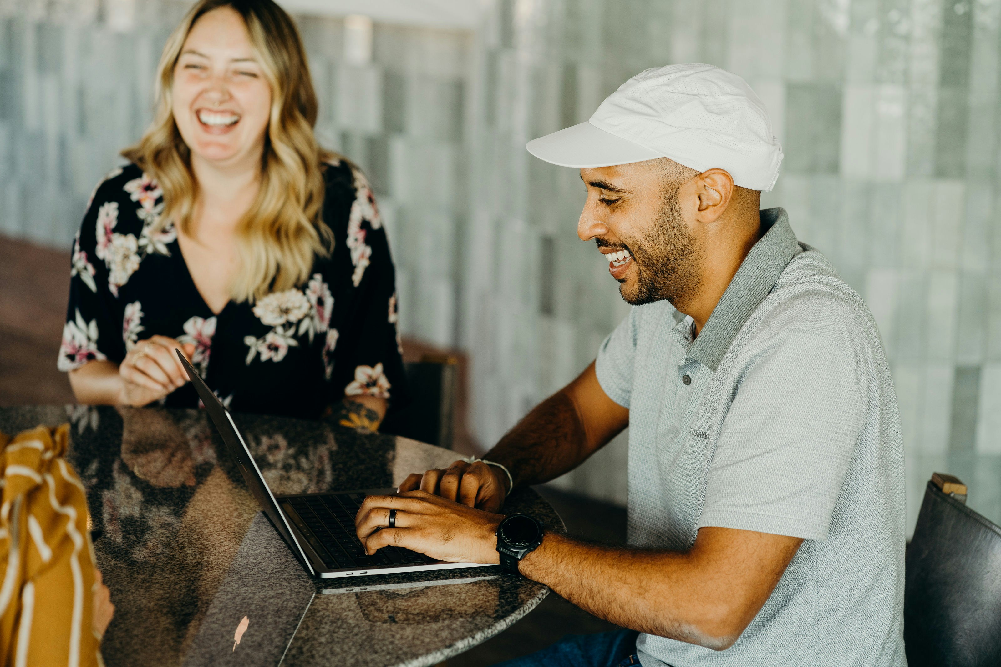 a man and a women working and laughing