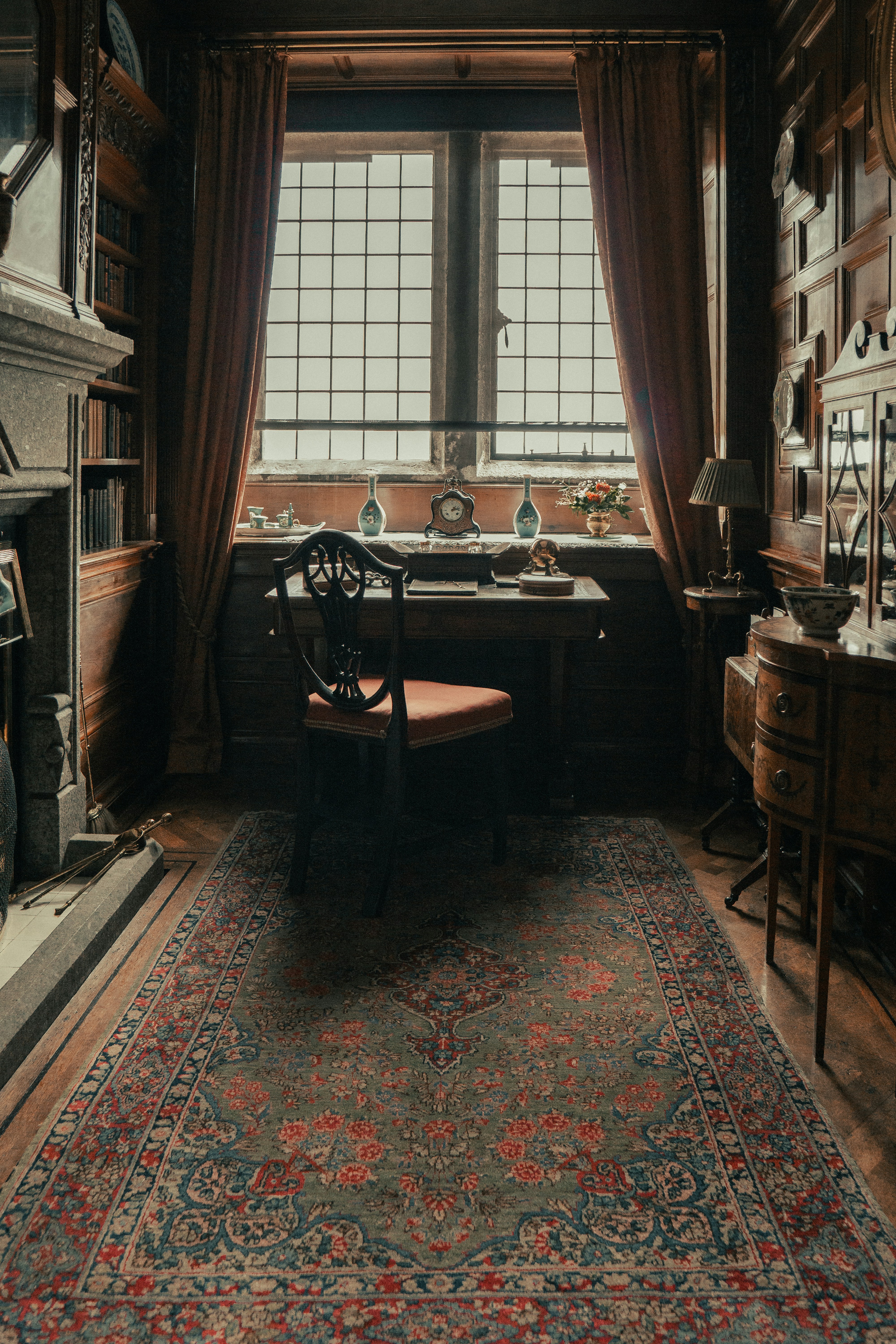a chair sitting in a room next to a window