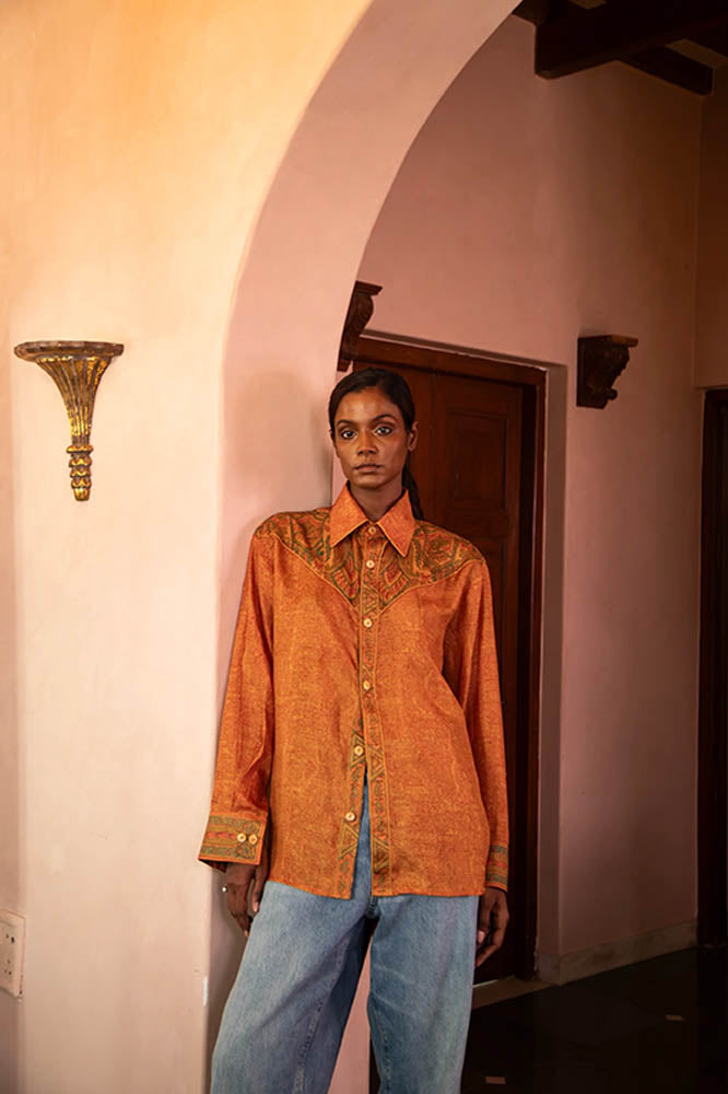 LAVYA vintage full-sleeve shirt in bold orange print with detailed collar and button placket, relaxed fit breathable fabric for effortless movement.