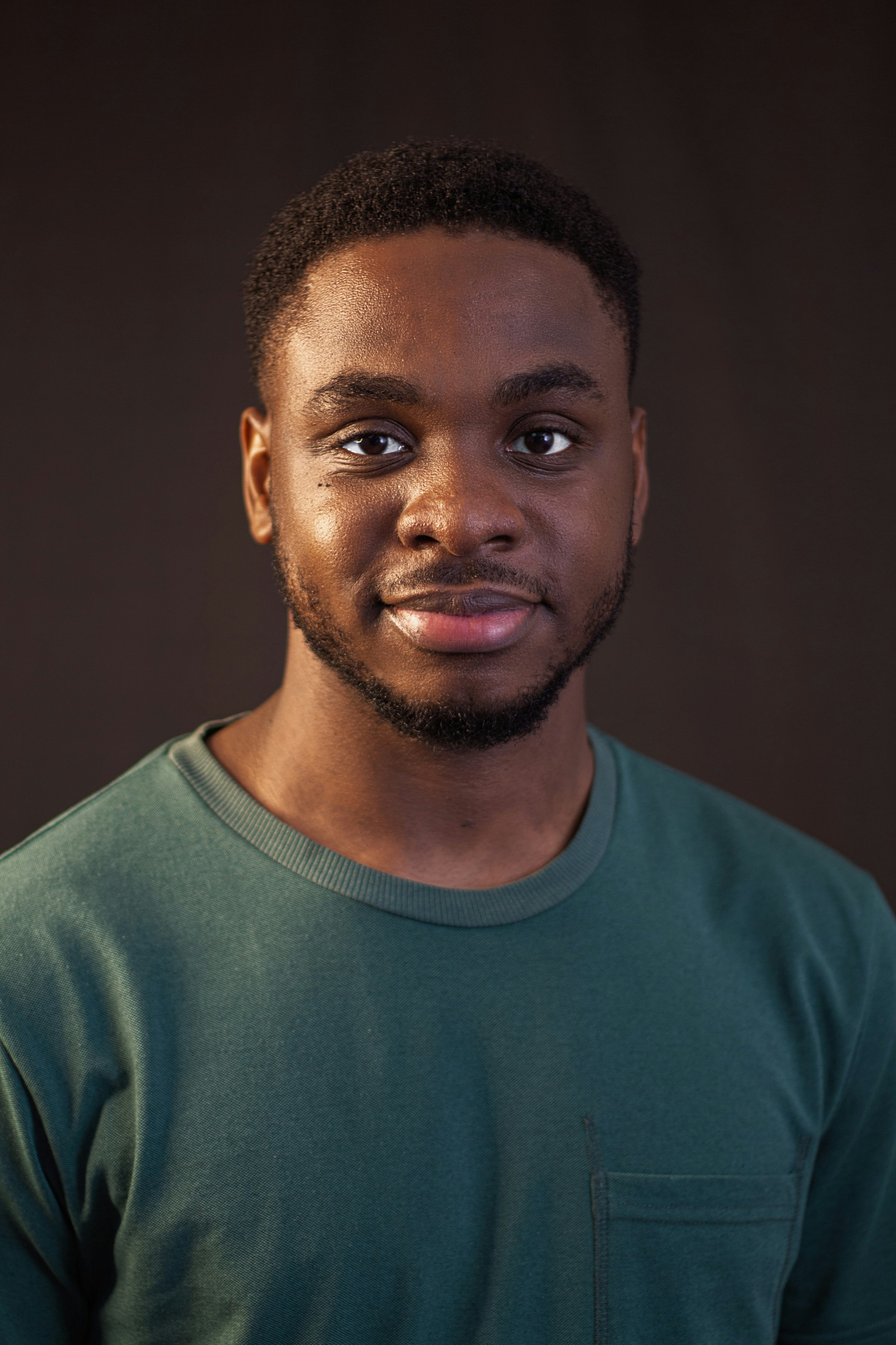 a man with a beard and a green shirt