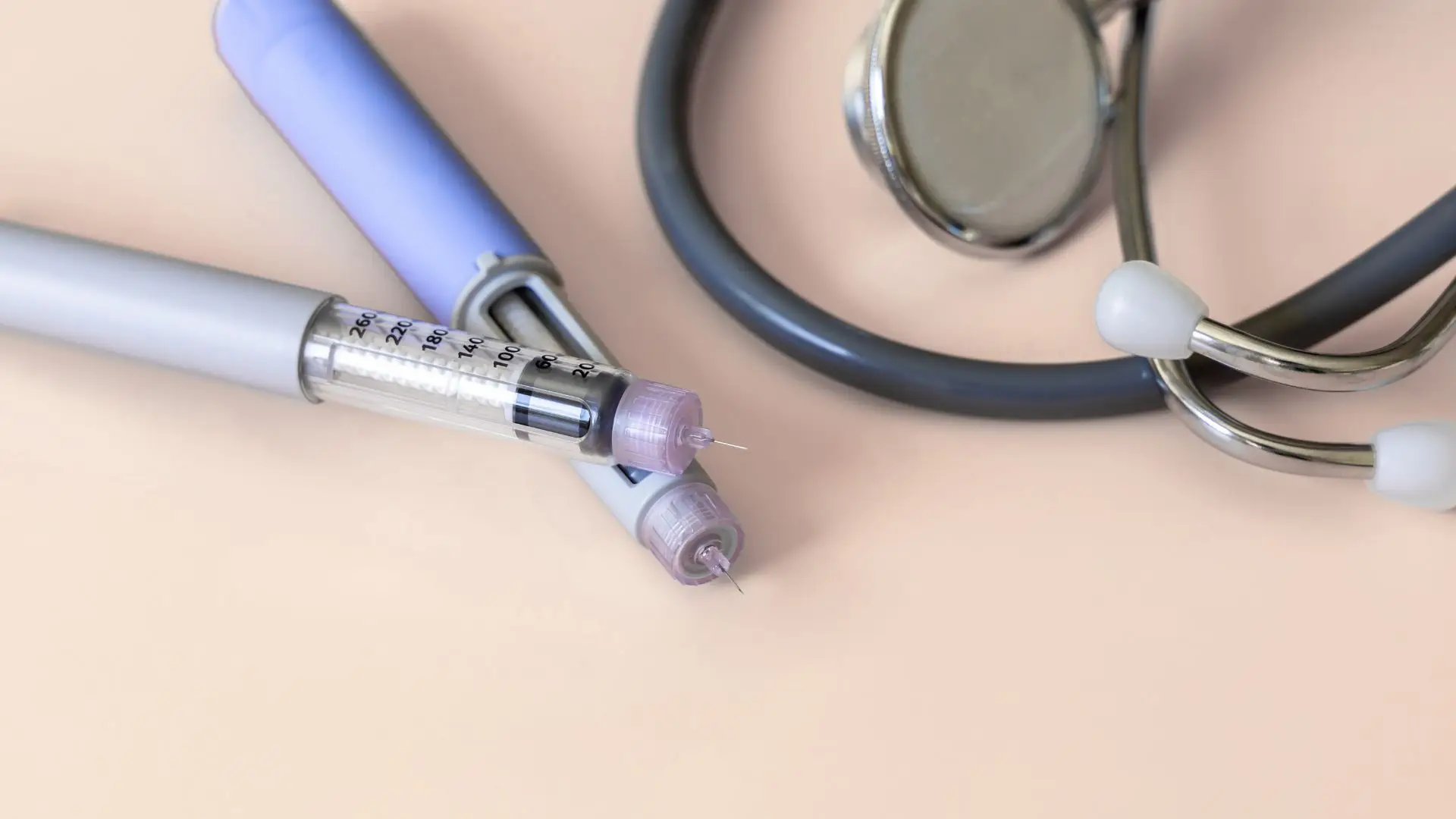 Ozempic pens beside a stethoscope