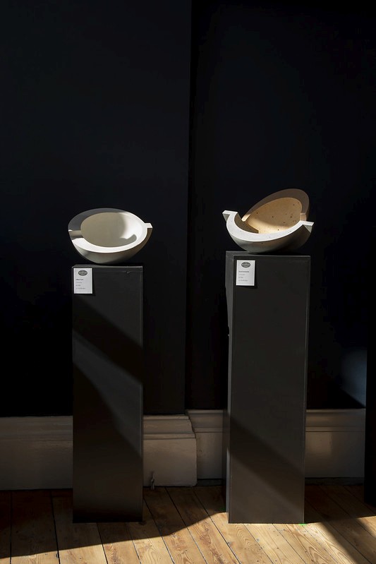 People crossing street with steam in urban setting