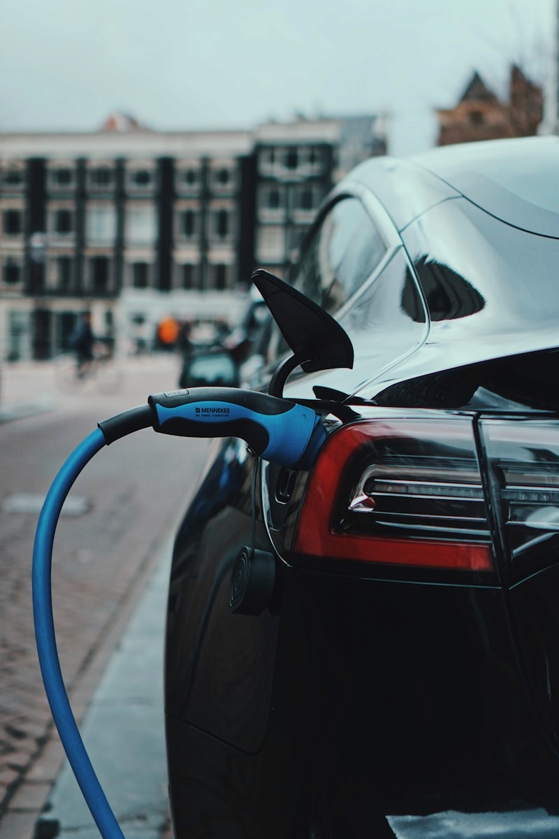 Sleek electric vehicle at a modern charging location
