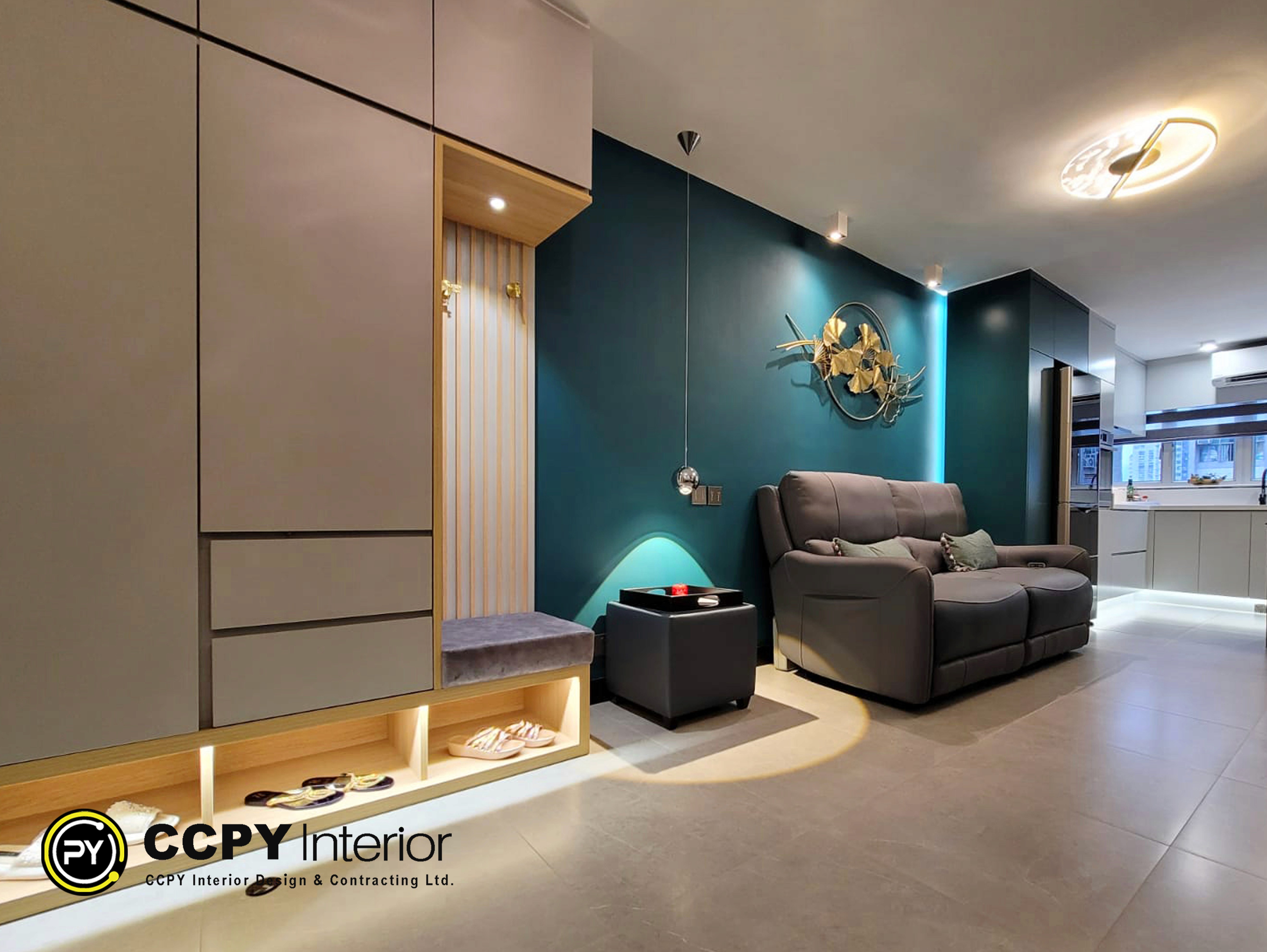 A minimalist fireplace with striking black marble veins integrated into a sleek media wall within a Mount Pavilia luxury house interior.