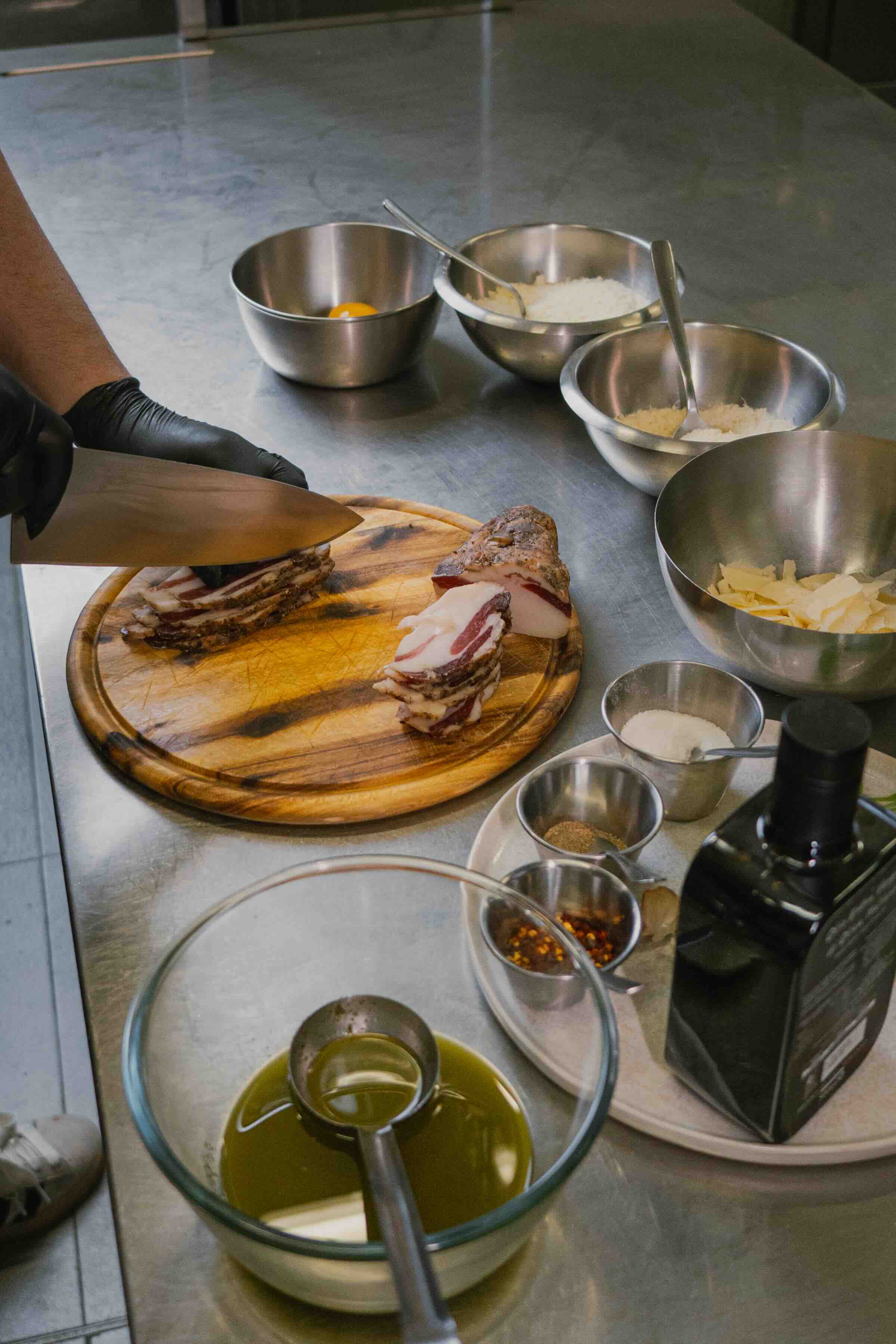 Barista in mask preparing coffee with moka pot