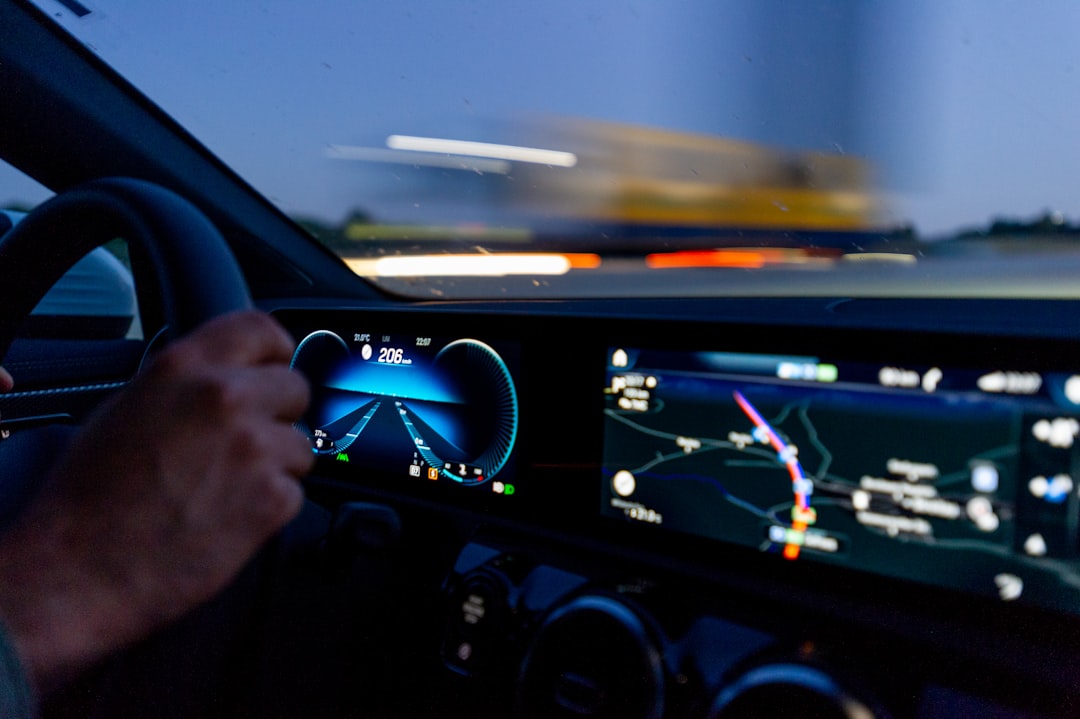 digital dashboard showing logistics metrics, glowing interface, hand adjusting a physical dial on a console