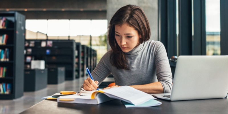 An Asian business owner conducting research