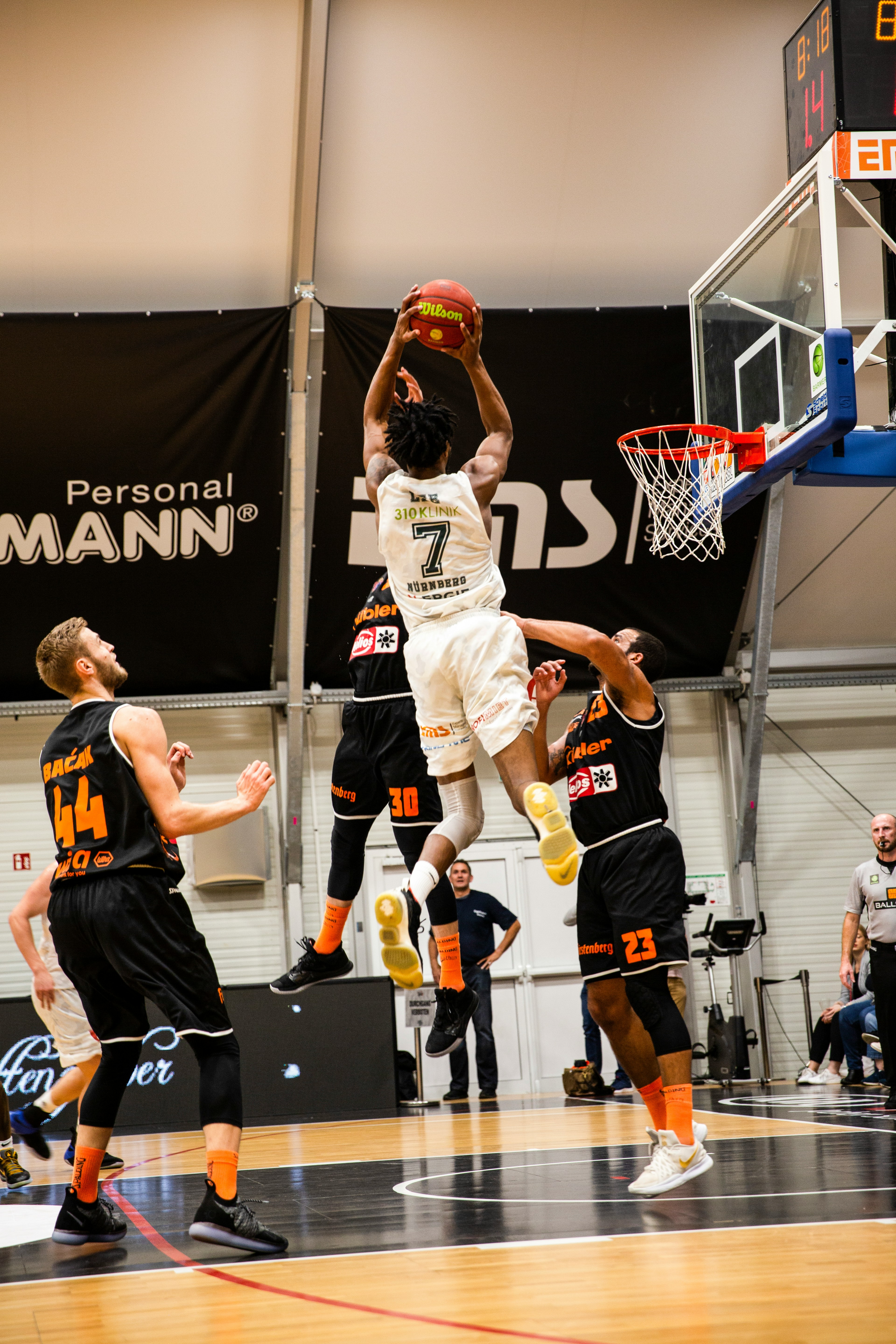 a basketball player about to shoot the ball for the hoops