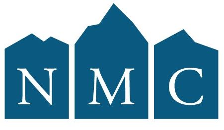 four people around a desk