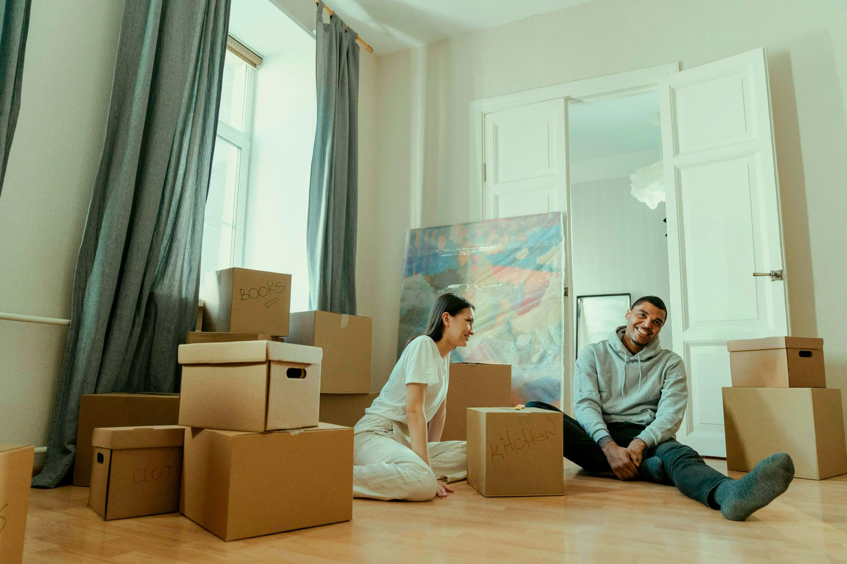 Couple taking a break from packing items.