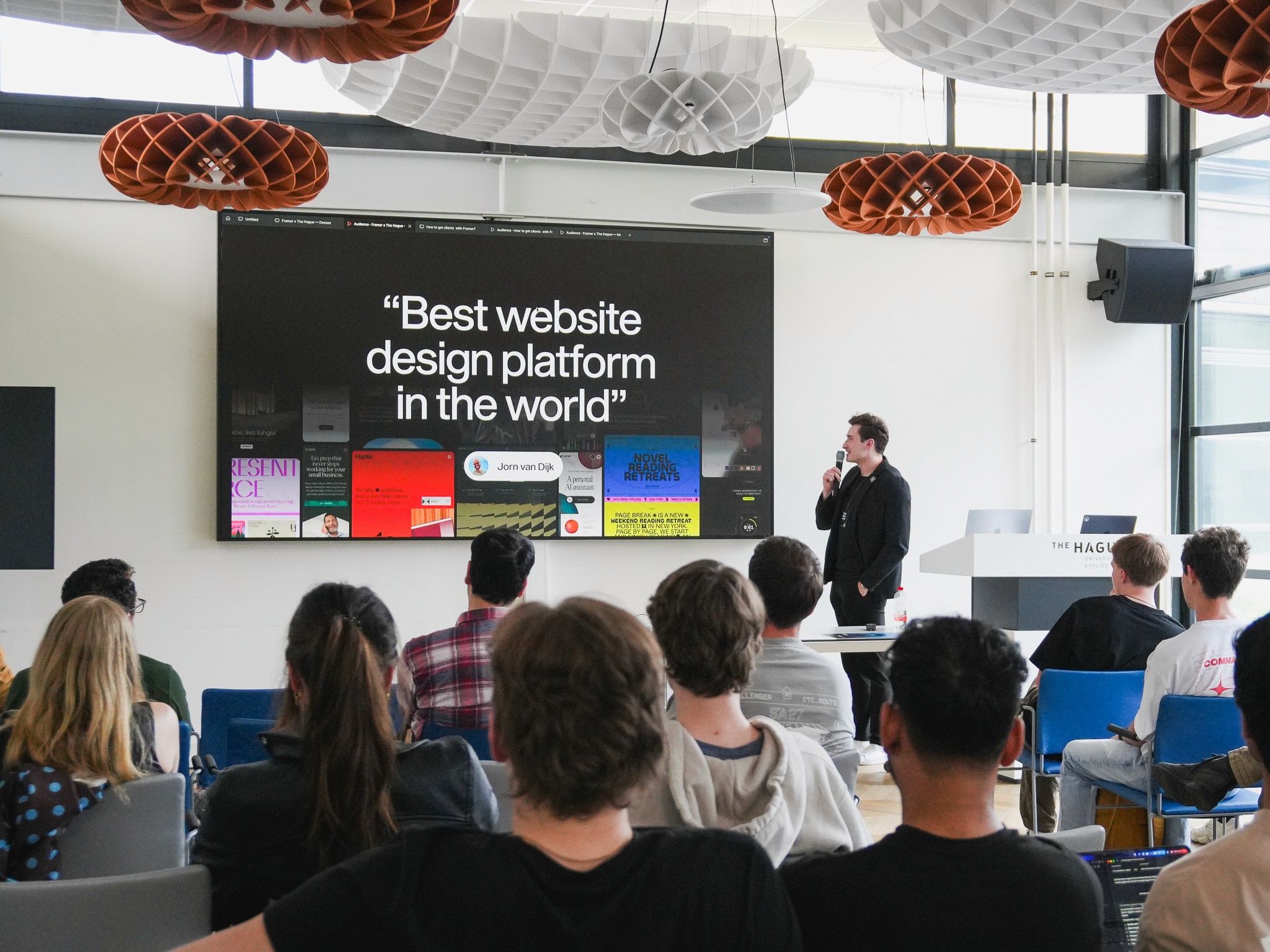 Oskar Mieta presenting on stage