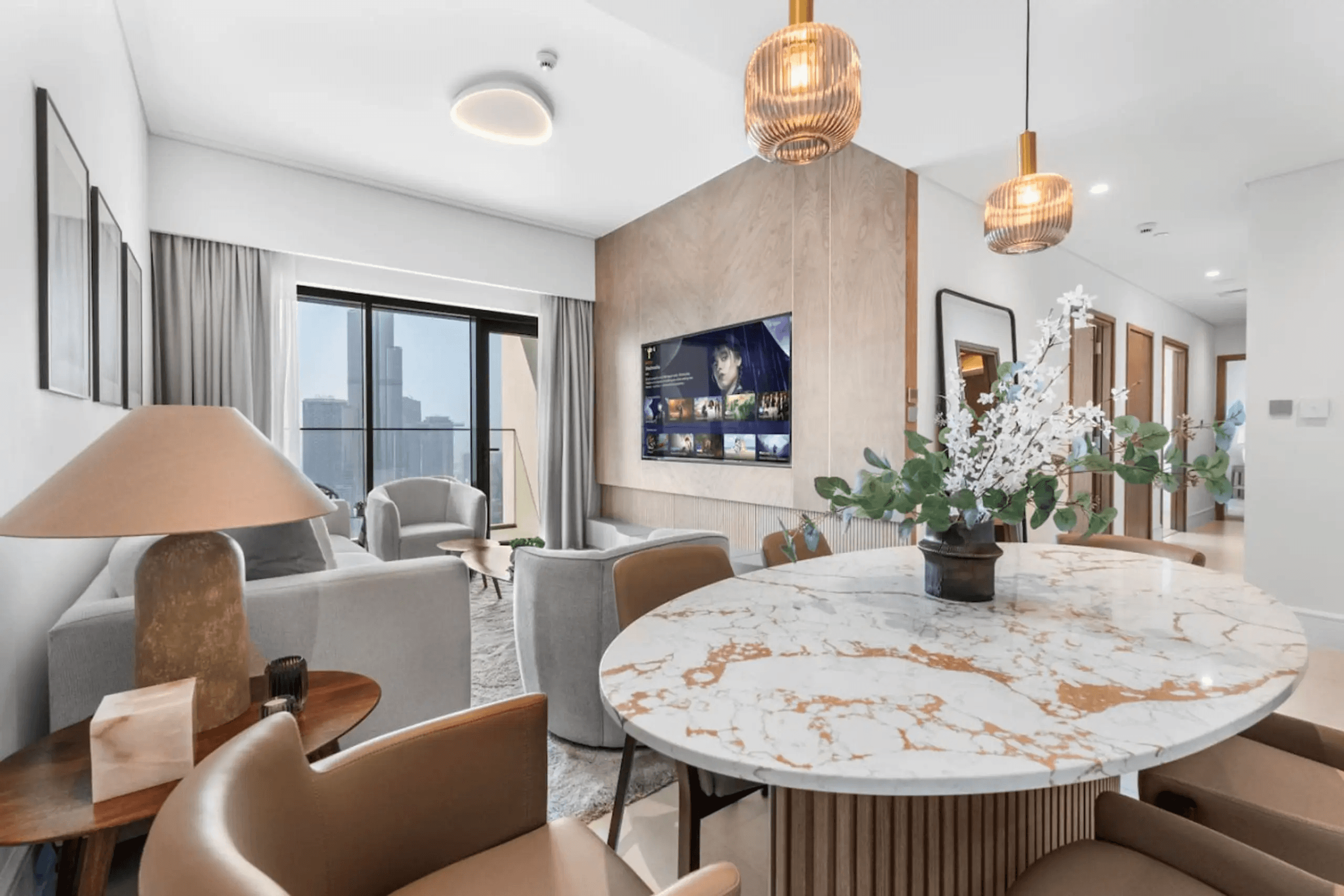 a living room with a couch, chair and table