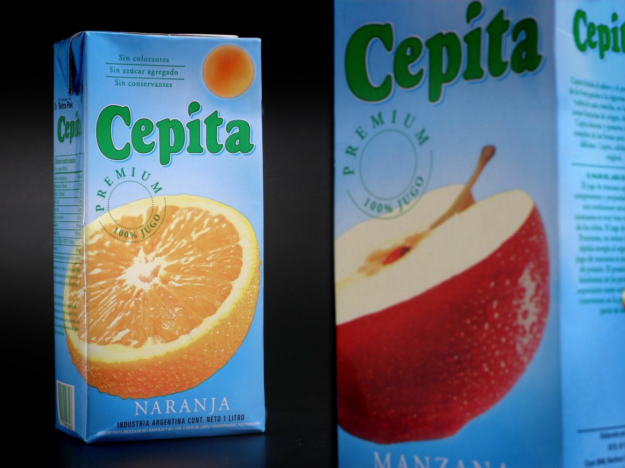 Rooftops of a coastal town with the sea in background