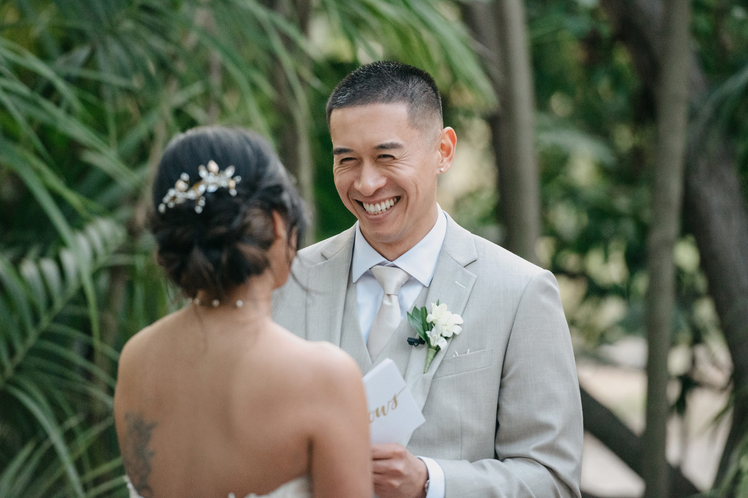 Flat lay wedding details with bouquet, rings, and sparkling bridal heels