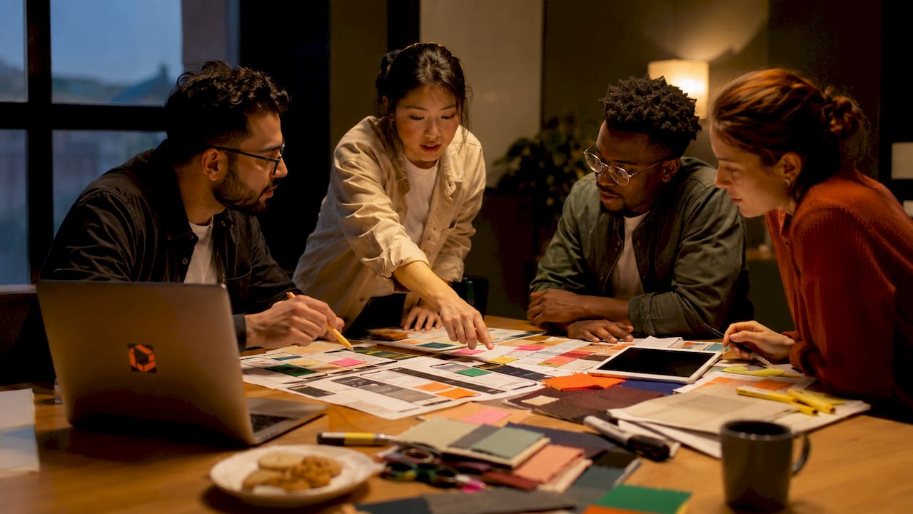 Top view of team discussing localized app screenshots