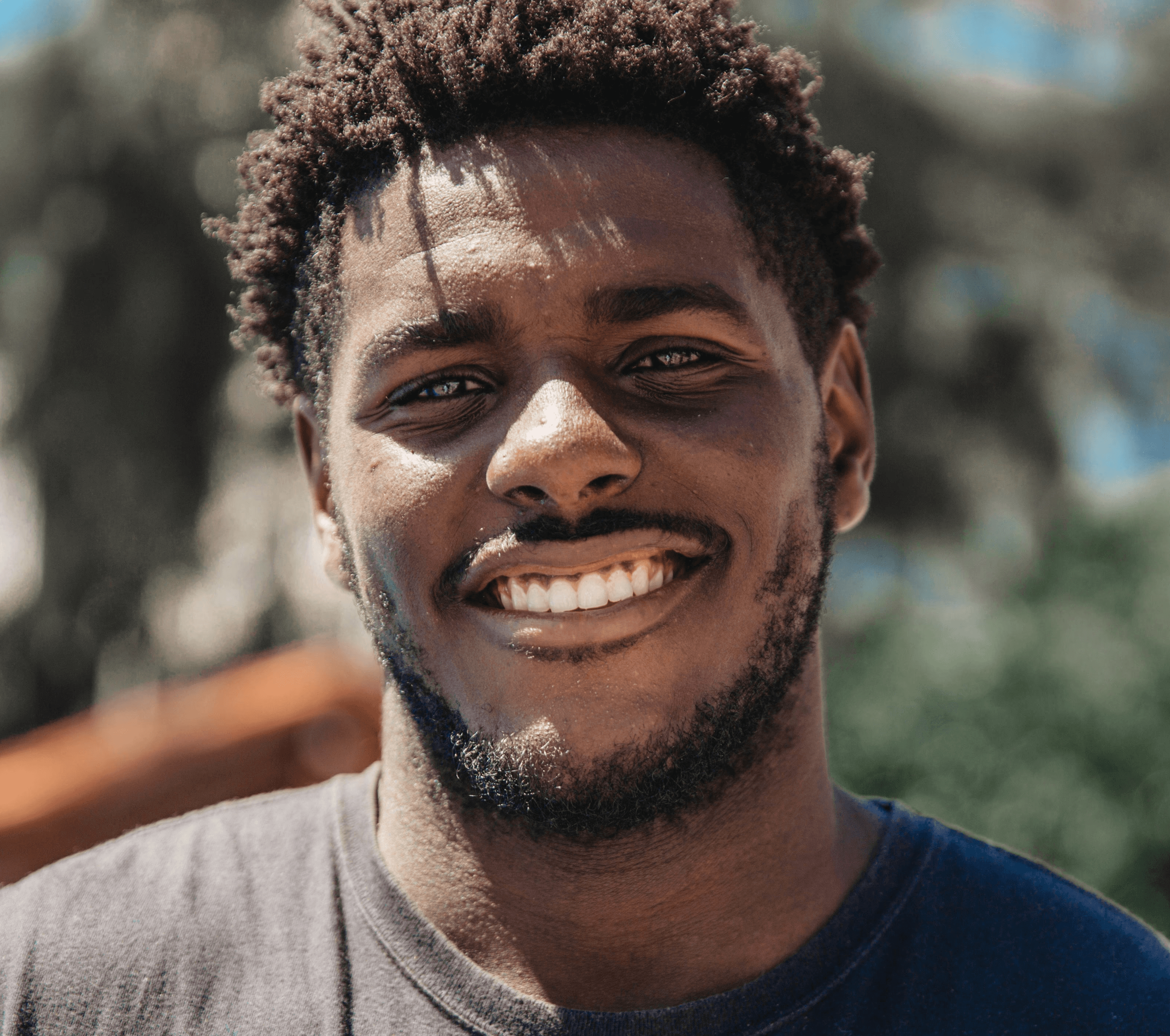selective focus of man smiling during daytime