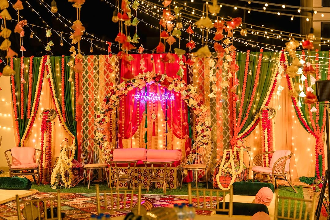 image of decor with flowers and colorful cloth and lights outdoor