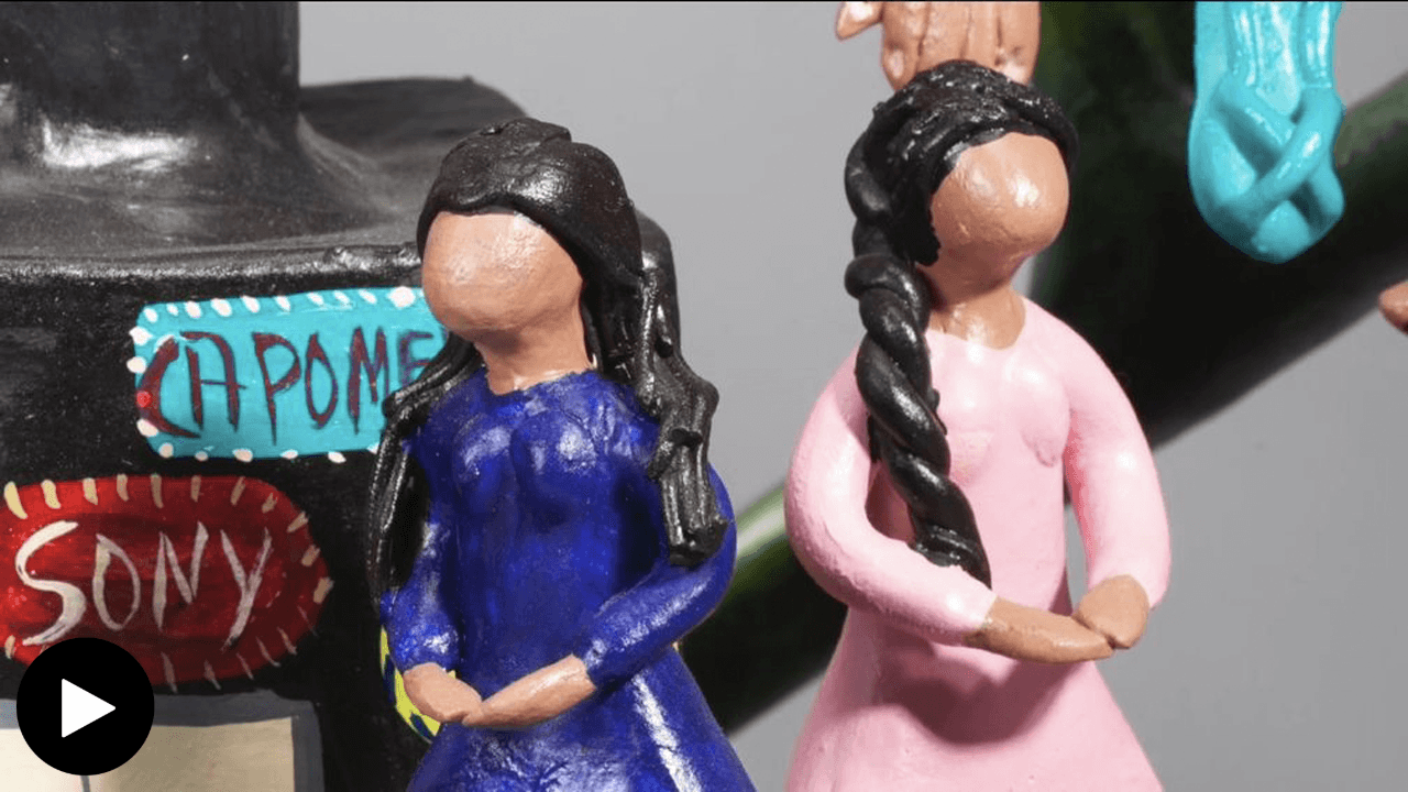 detail of two faceless women figures from Tree of Death