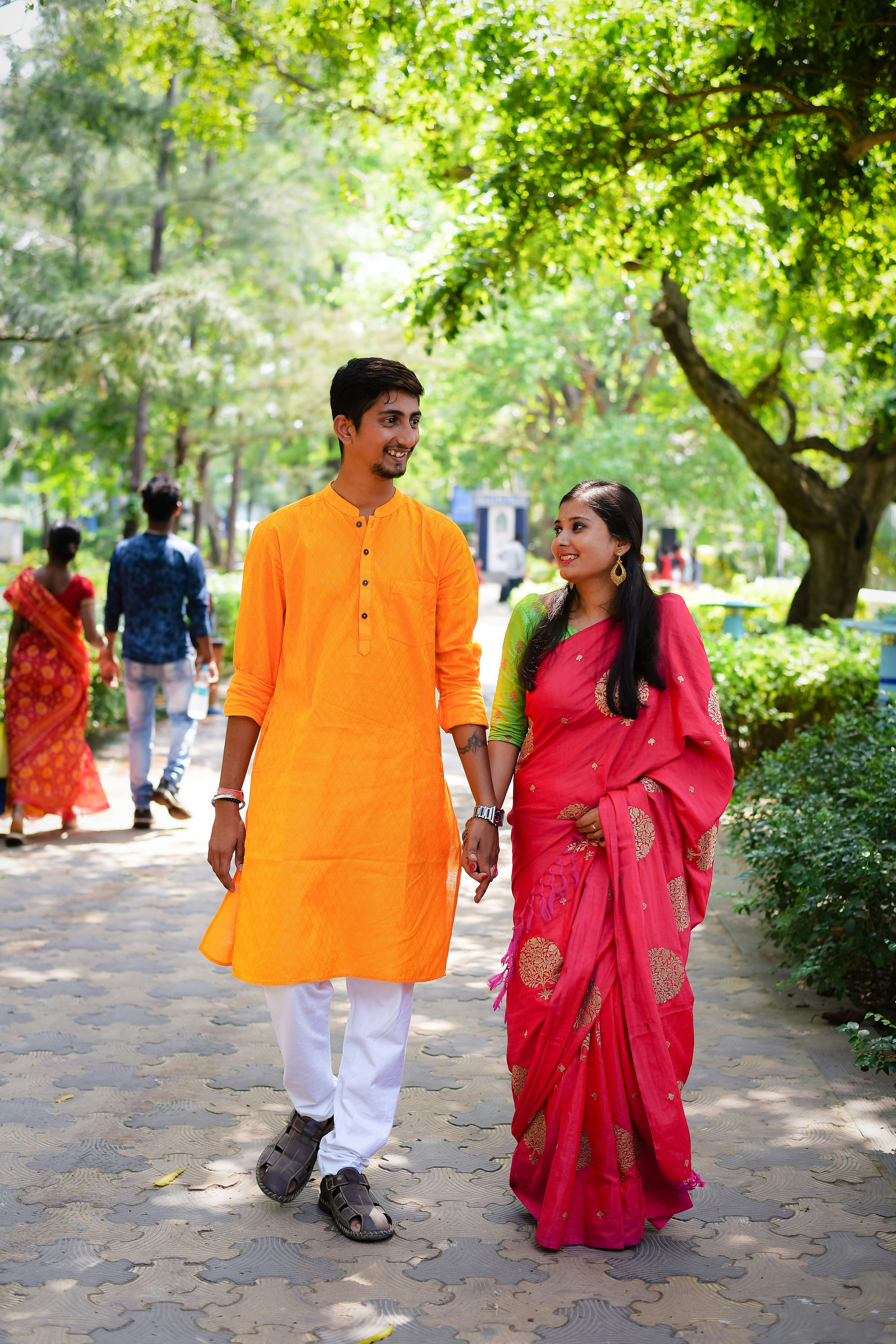 A man and a woman walking down a path