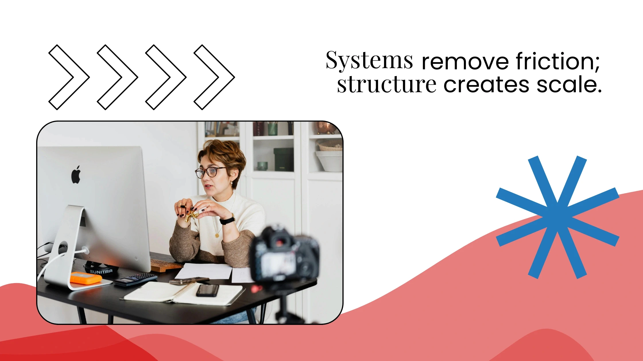 Coach working at a desk with a desktop computer, paired with text about systems reducing friction and enabling scale.