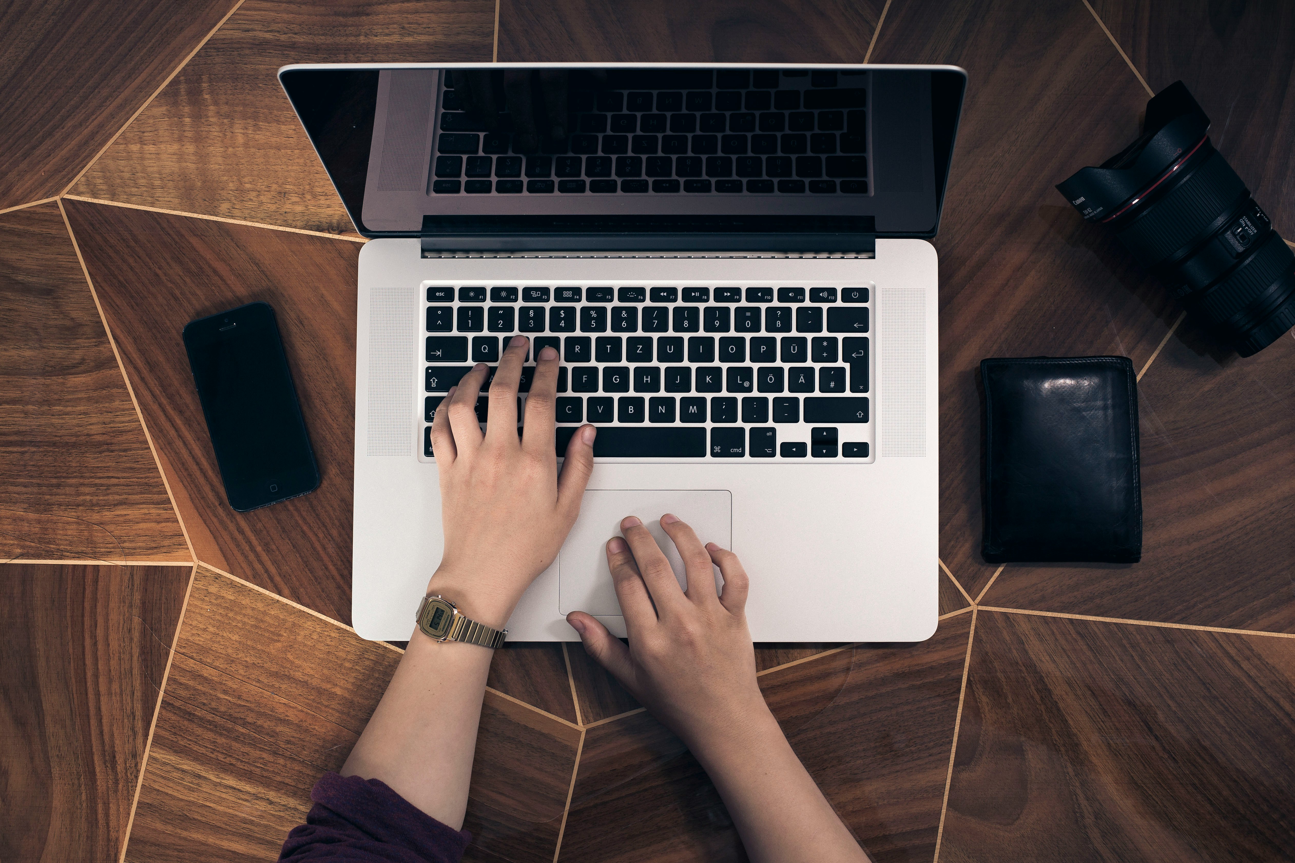 person working on laptop - How To Promote Music On Tiktok