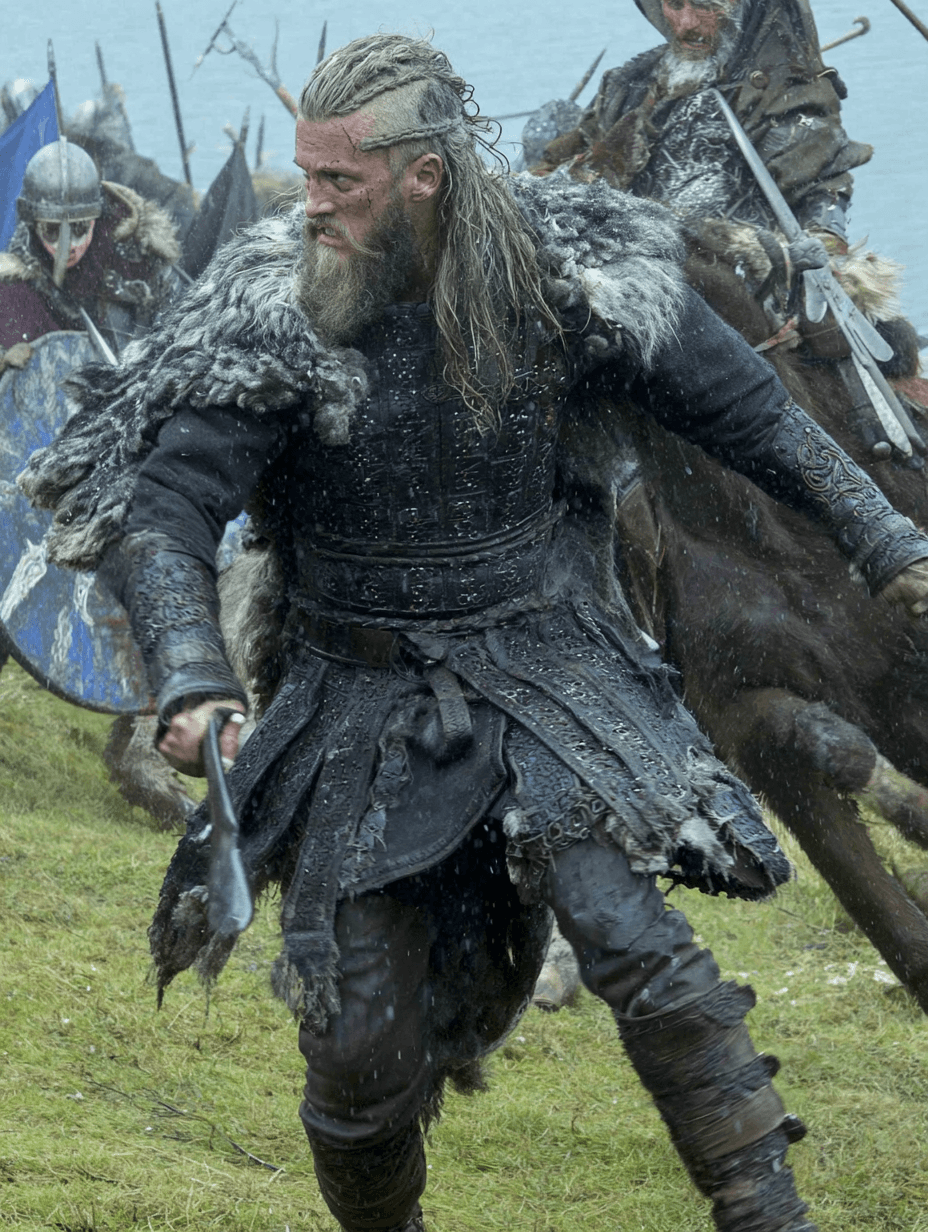 A bearded Viking warlord in fur-lined armor swings an axe while advancing across a rain-soaked battlefield, fellow warriors and shields blurred behind him.