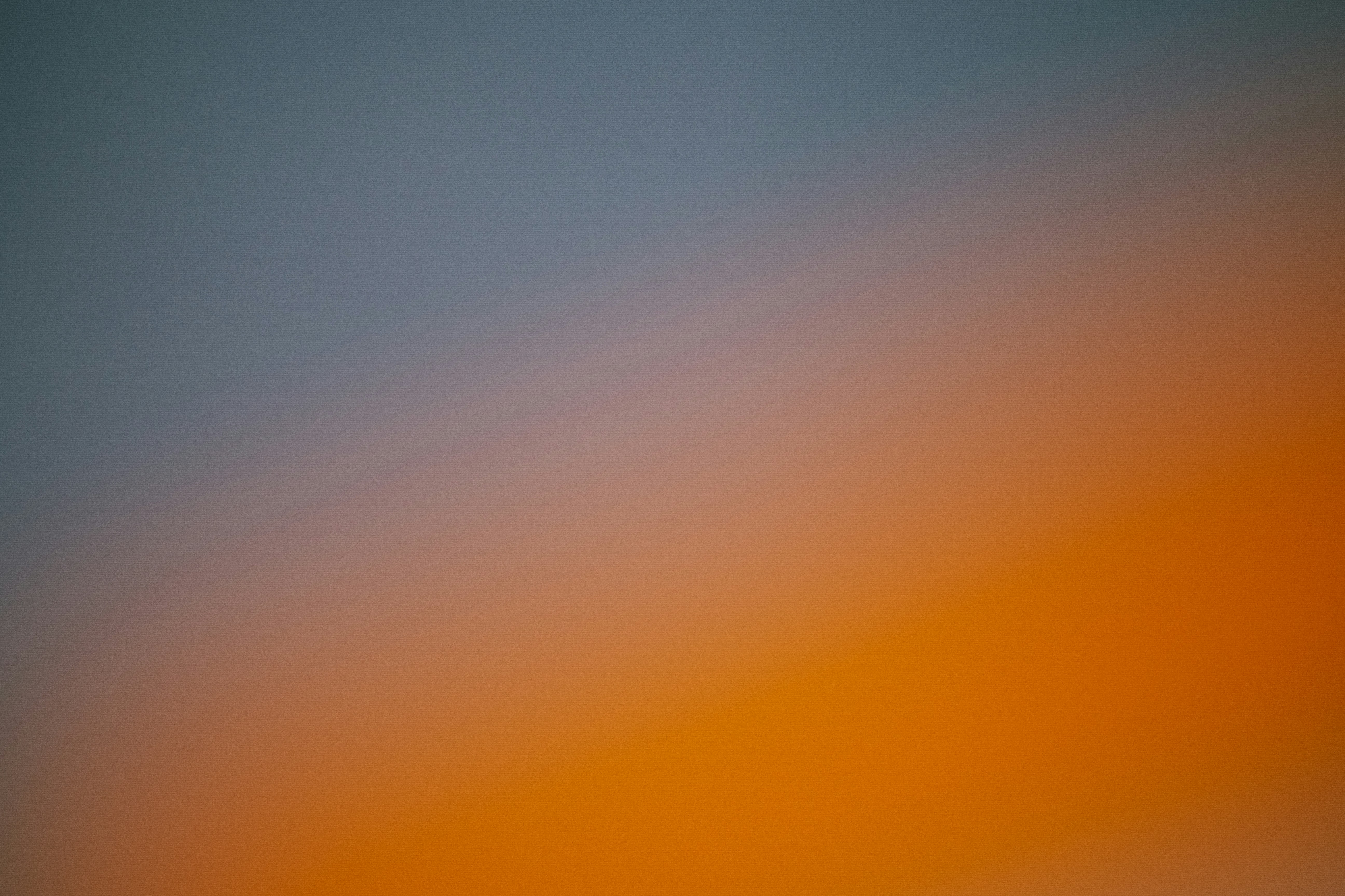Gradient of blue to orange sky at dusk
