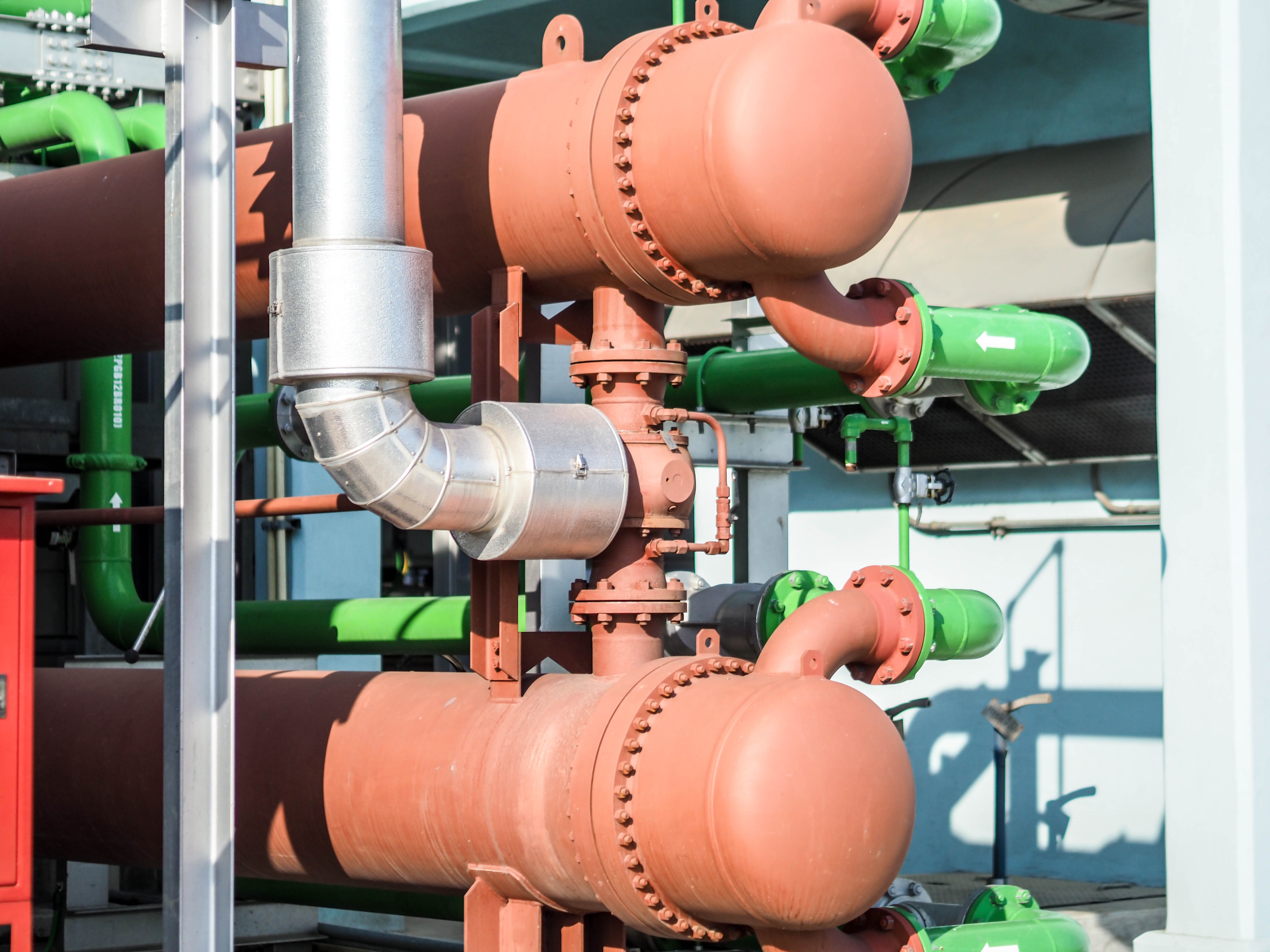 Complex network of industrial columns, heat exchangers, and reactors used in chemical processing