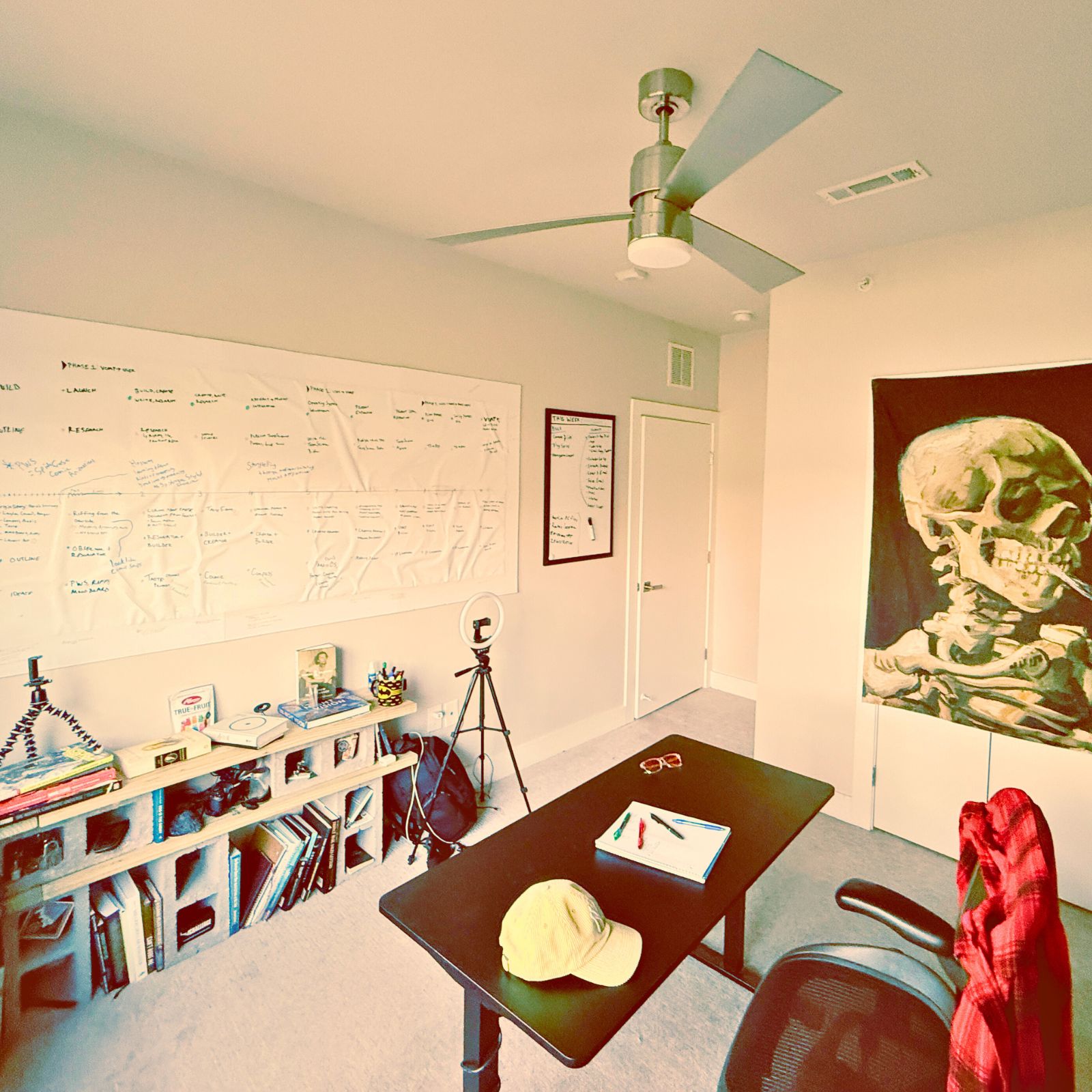 Two men in a creative studio discussing content ideas for production.