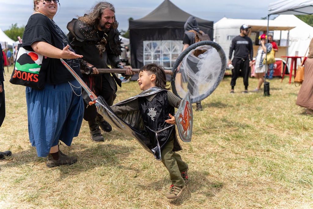 Minor child dressed as knight playing with net at wrf