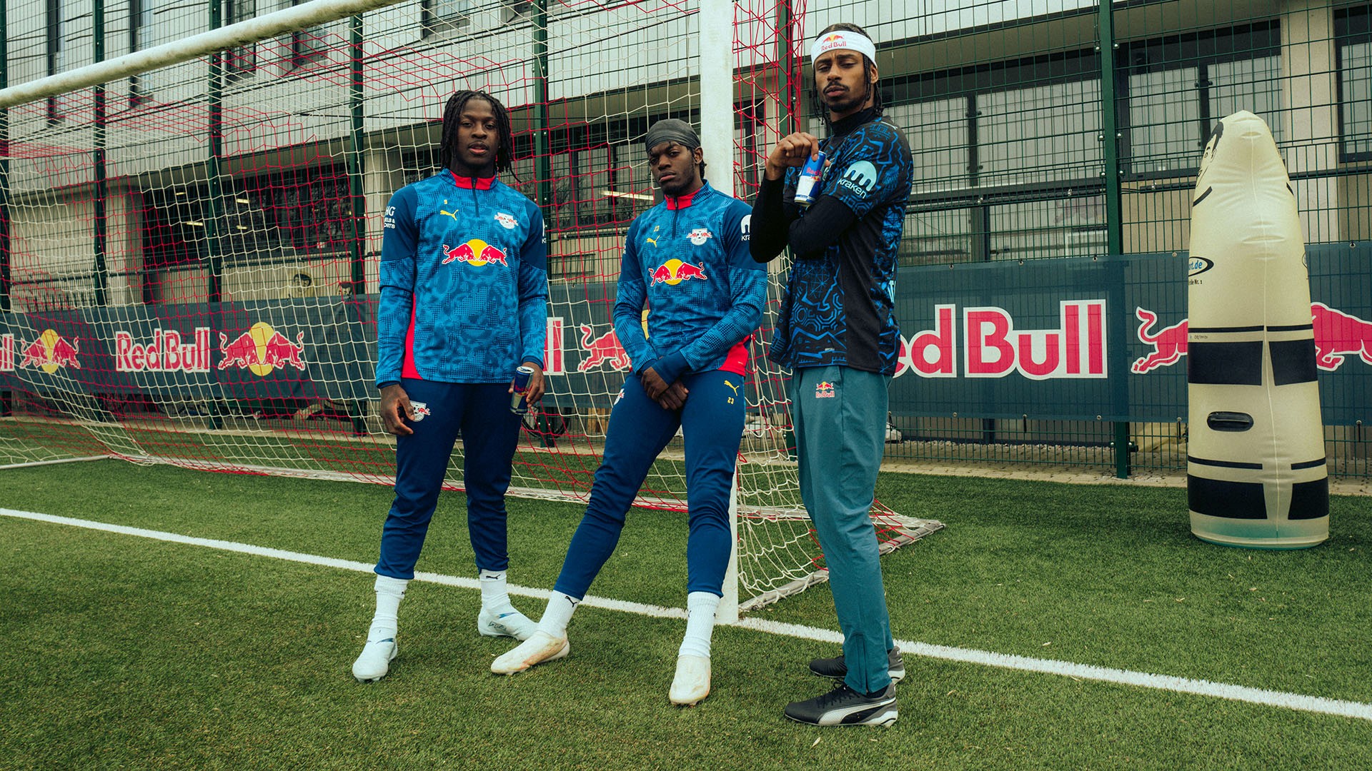 Stalamuerte dancing with RB Leipzig players Bakayoko and Lukeba at the Red Bull Training Center, Leipzig.