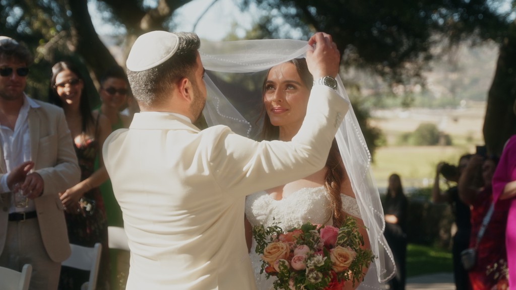 a man and a woman standing in the snow