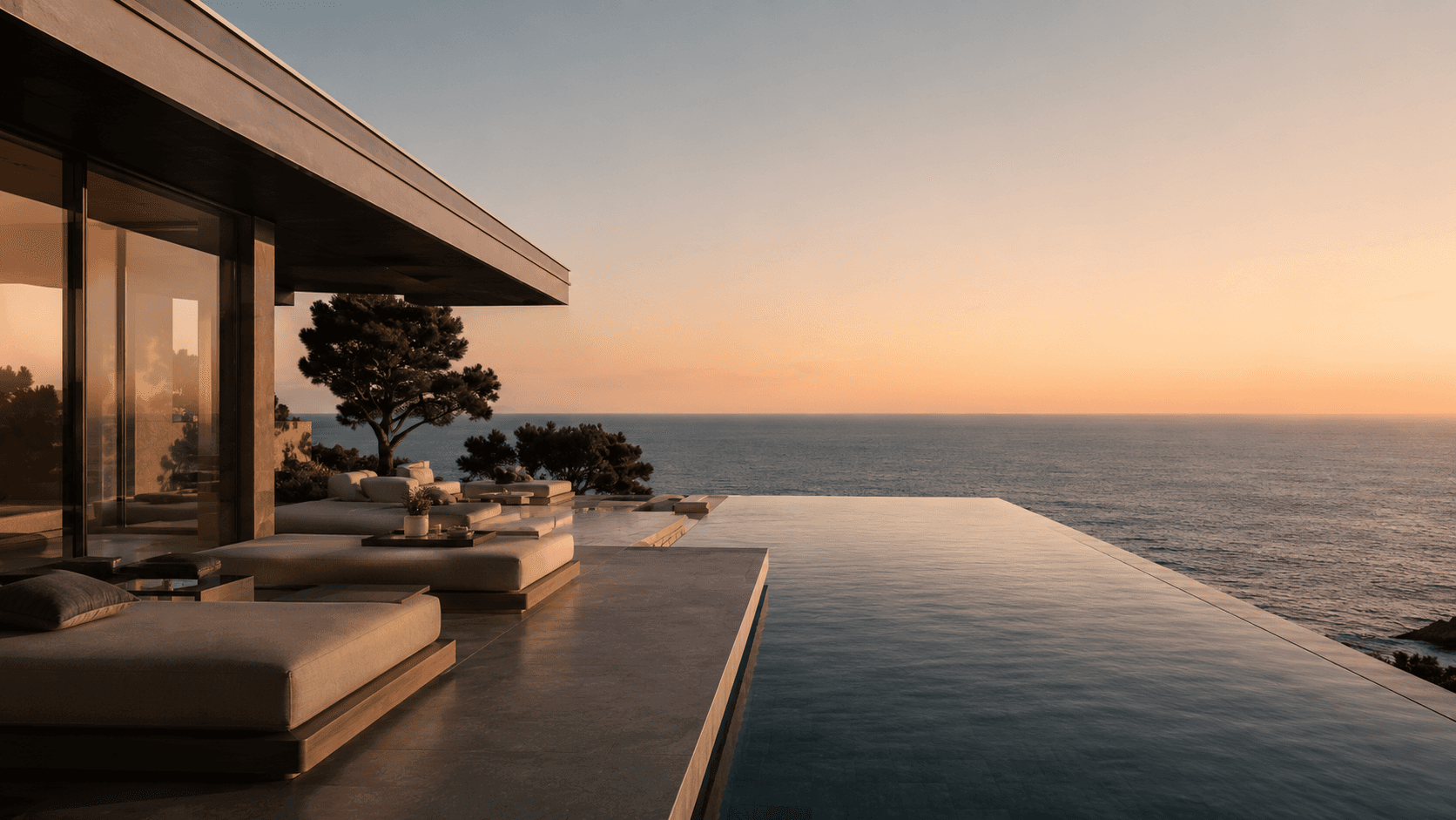 Villa moderna con infinity pool affacciata sul mare al tramonto