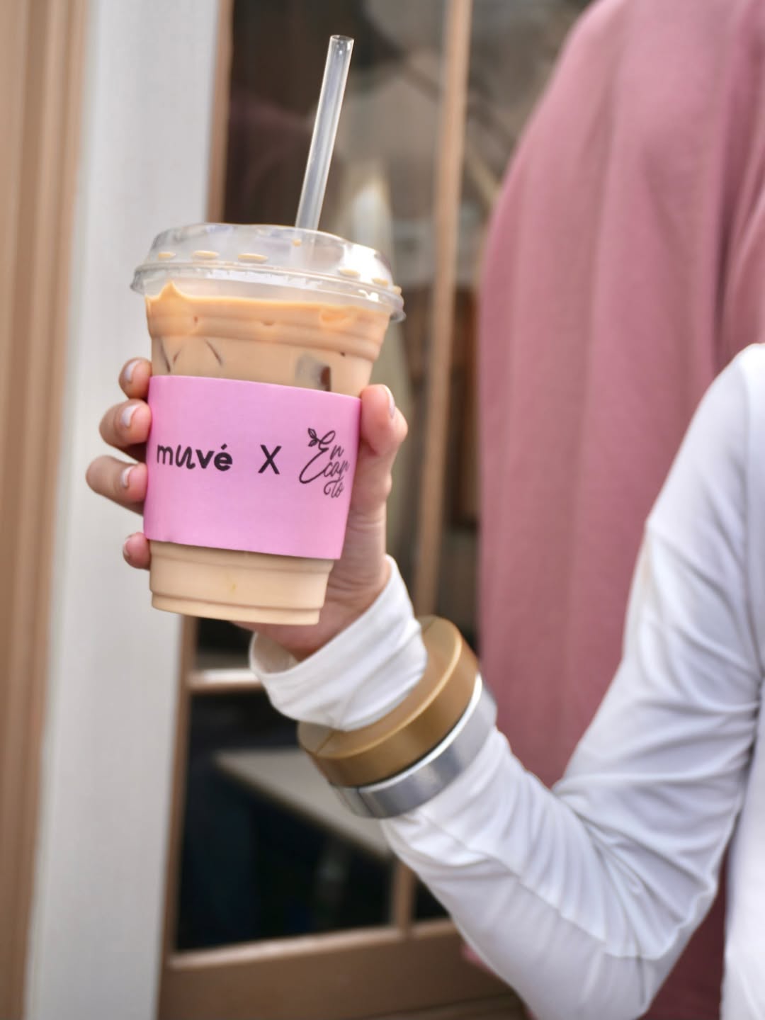 a brown leather chair sitting in front of a window