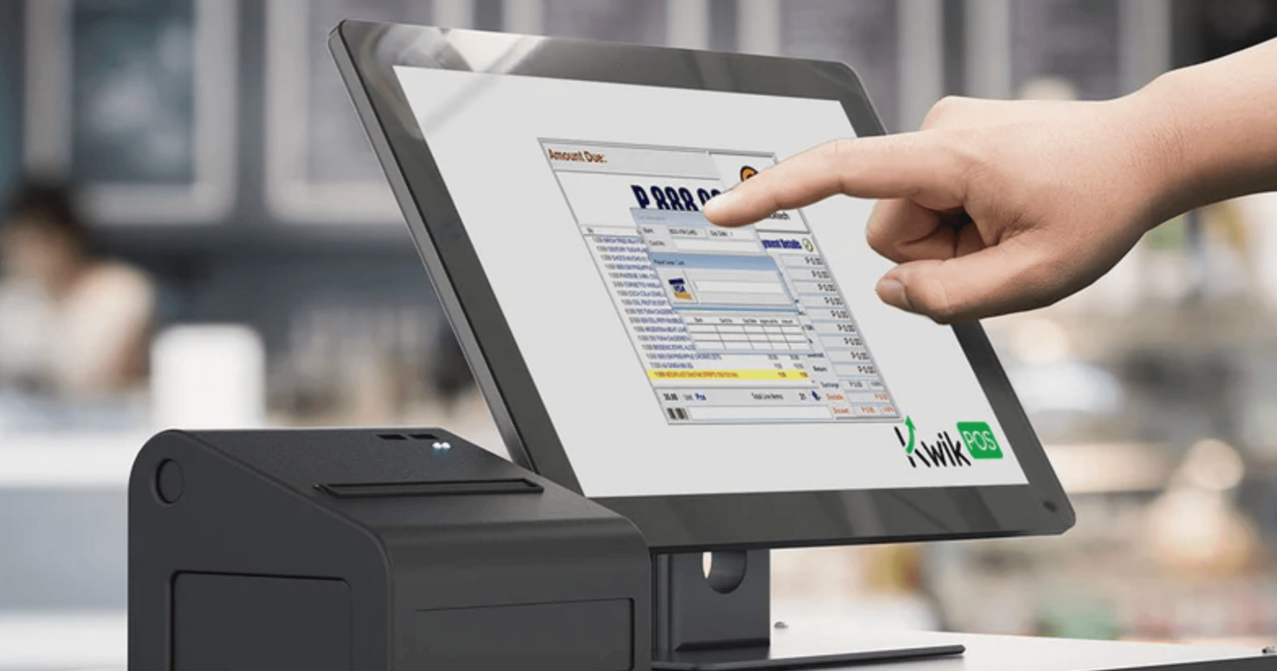 A staff tapping KwikPOS' pos.