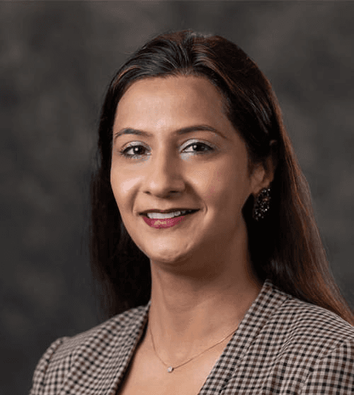 smiling woman wearing white and black pinstriped collared top