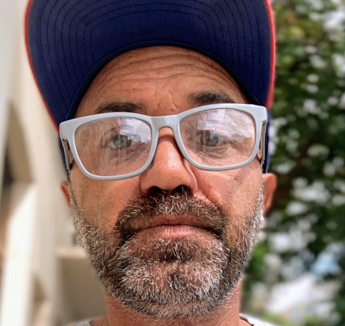 Female with glasses looking at the camera